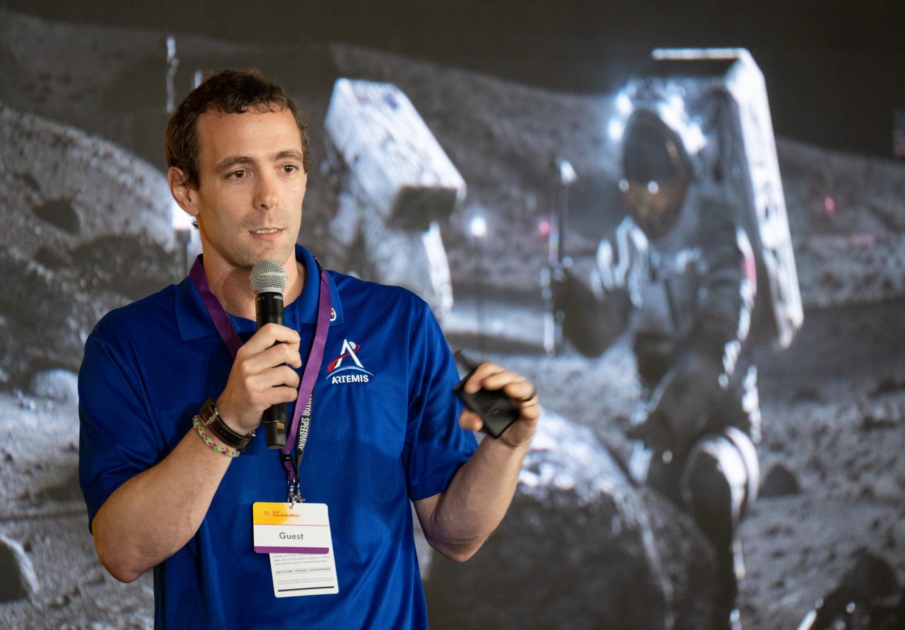 Logan Kennedy, surface lead for Human Landing System Programs in NASA's Exploration Systems Development Mission Directorate, speaks to students about power production and energy for the Artemis Program at the Shell Eco-marathon Americas, Saturday, April 6, 2024, at the Indianapolis Motor Speedway in Indianapolis, Ind. Photo Credit: (NASA/Joel Kowsky)