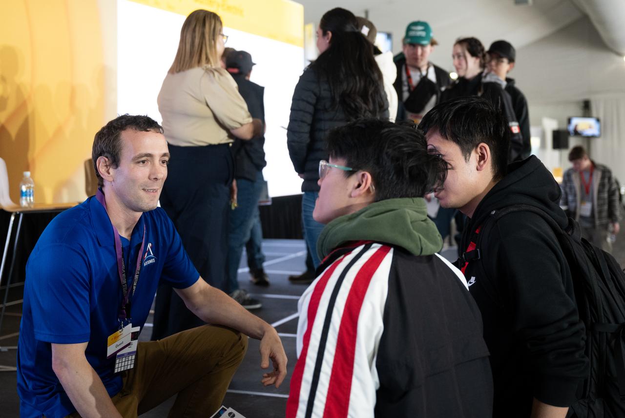 Logan Kennedy, surface lead for Human Landing System Programs in NASA's Exploration Systems Development Mission Directorate, speaks to students after discussing about power production and energy for the Artemis Program at the Shell Eco-marathon Americas, Saturday, April 6, 2024, at the Indianapolis Motor Speedway in Indianapolis, Ind. Photo Credit: (NASA/Joel Kowsky)