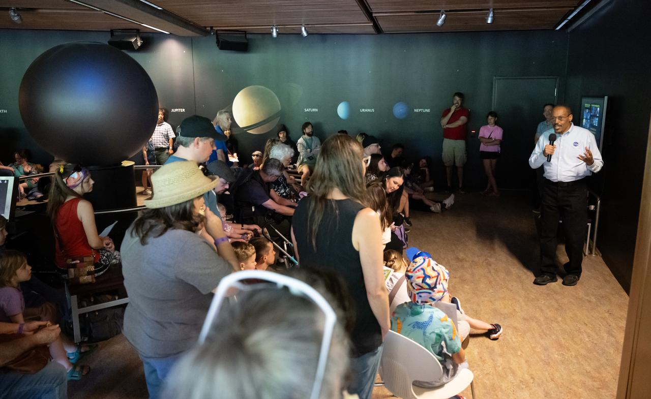 Former NASA astronaut Alvin Drew, right, speaks with guests at the Dallas Arboretum, Sunday, April 7, 2024, in Dallas, Texas. On Monday, April 8, a total solar eclipse will sweep across a narrow portion of the North American continent from Mexico’s Pacific coast to the Atlantic coast of Newfoundland, Canada, while a partial solar eclipse will be visible across the entire North American continent along with parts of Central America and Europe. Photo Credit: (NASA/Keegan Barber)