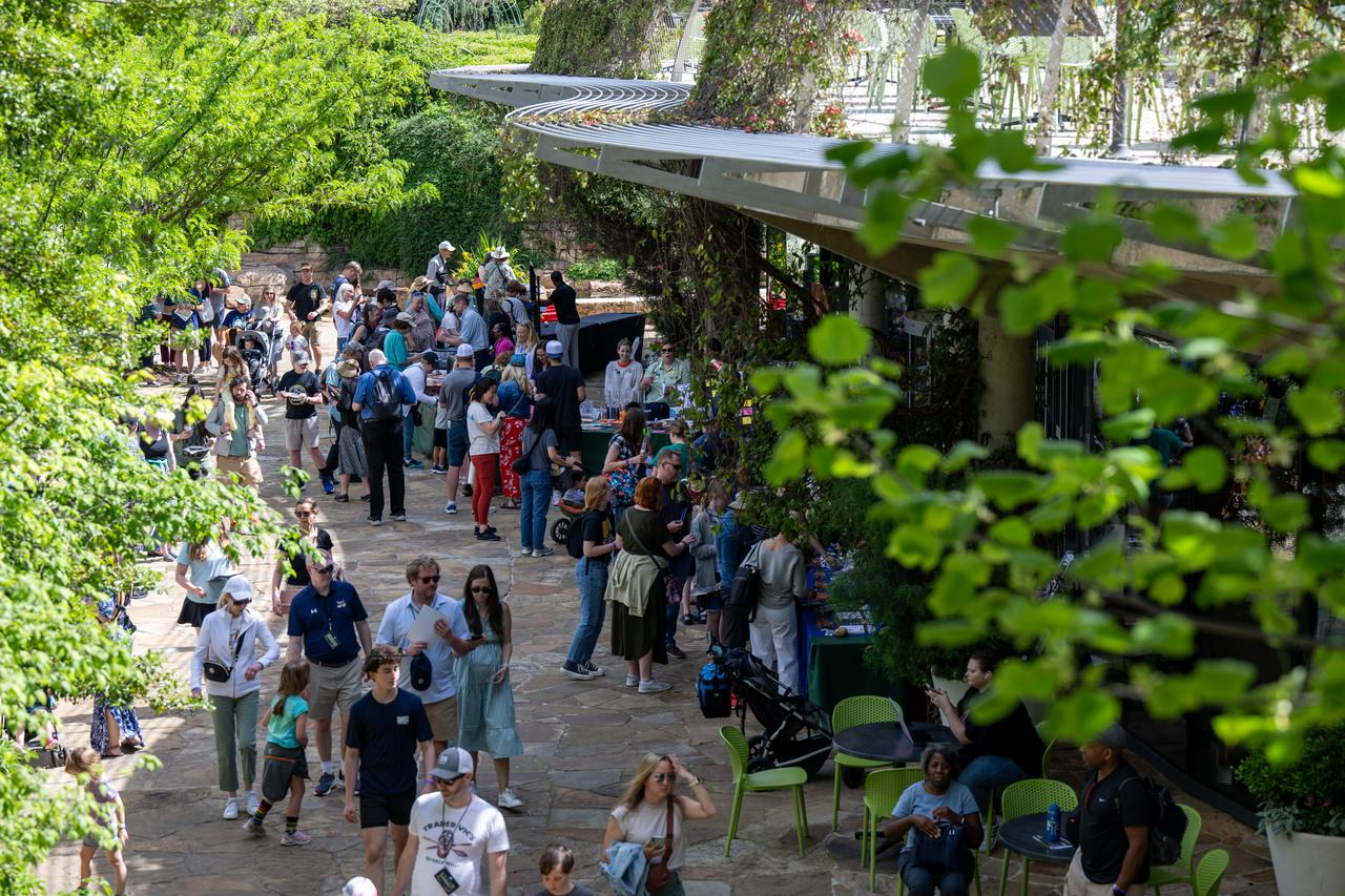 Guests learn about the upcoming total solar eclipse from NASA staff at the Dallas Arboretum, Sunday, April 7, 2024, in Dallas, Texas. On Monday, April 8, a total solar eclipse will sweep across a narrow portion of the North American continent from Mexico’s Pacific coast to the Atlantic coast of Newfoundland, Canada, while a partial solar eclipse will be visible across the entire North American continent along with parts of Central America and Europe. Photo Credit: (NASA/Keegan Barber)