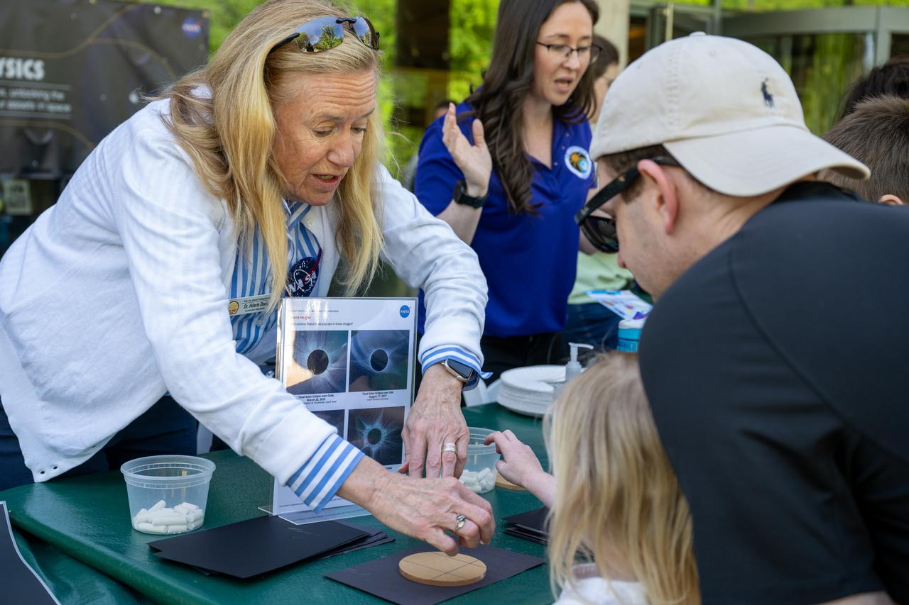 NASA Curriculum Specialist Dr. Hilarie Davis speaks to guests about the upcoming total solar eclipse at the Dallas Arboretum, Sunday, April 7, 2024, in Dallas, Texas. On Monday, April 8, a total solar eclipse will sweep across a narrow portion of the North American continent from Mexico’s Pacific coast to the Atlantic coast of Newfoundland, Canada, while a partial solar eclipse will be visible across the entire North American continent along with parts of Central America and Europe. Photo Credit: (NASA/Keegan Barber)