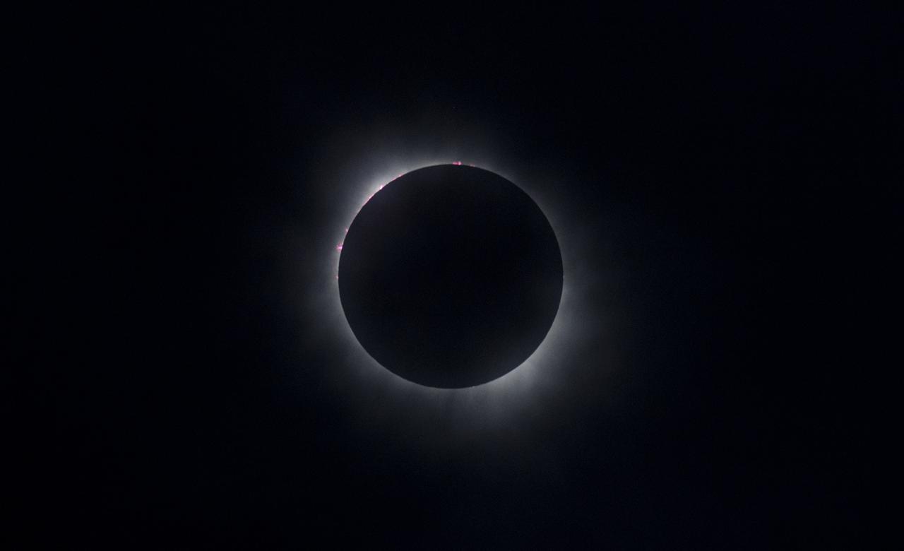 A total solar eclipse is seen in Kerrville, TX on Monday, April 8, 2024. A total solar eclipse swept across a narrow portion of the North American continent from Mexico’s Pacific coast to the Atlantic coast of Newfoundland, Canada. A partial solar eclipse was visible across the entire North American continent along with parts of Central America and Europe.  Photo Credit: (NASA/Aubrey Gemignani)