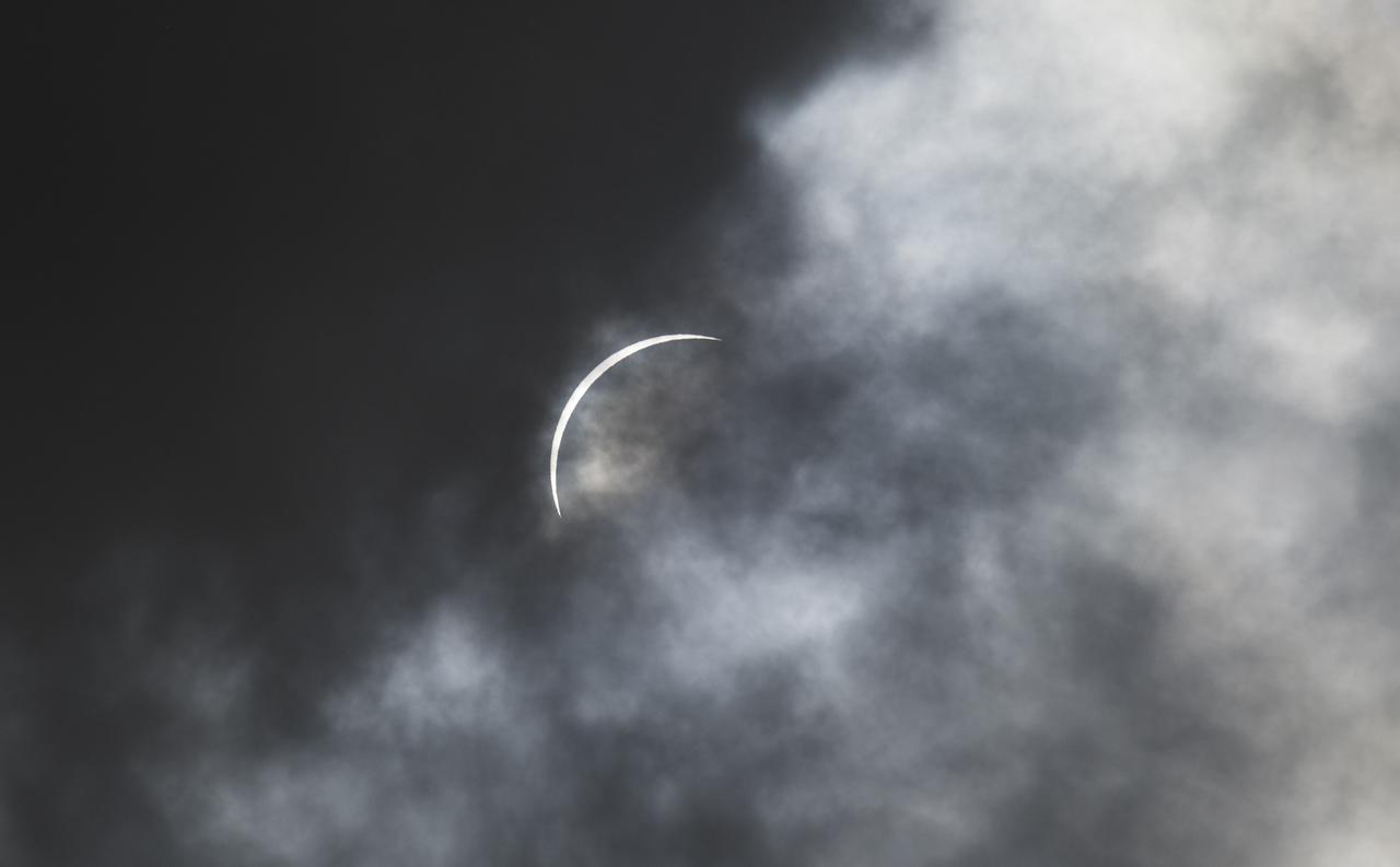 The Moon is seen passing in front of the Sun just before totality during a solar eclipse in Kerrville, TX on Monday, April 8, 2024. A total solar eclipse swept across a narrow portion of the North American continent from Mexico’s Pacific coast to the Atlantic coast of Newfoundland, Canada. A partial solar eclipse was visible across the entire North American continent along with parts of Central America and Europe.  Photo Credit: (NASA/Aubrey Gemignani)