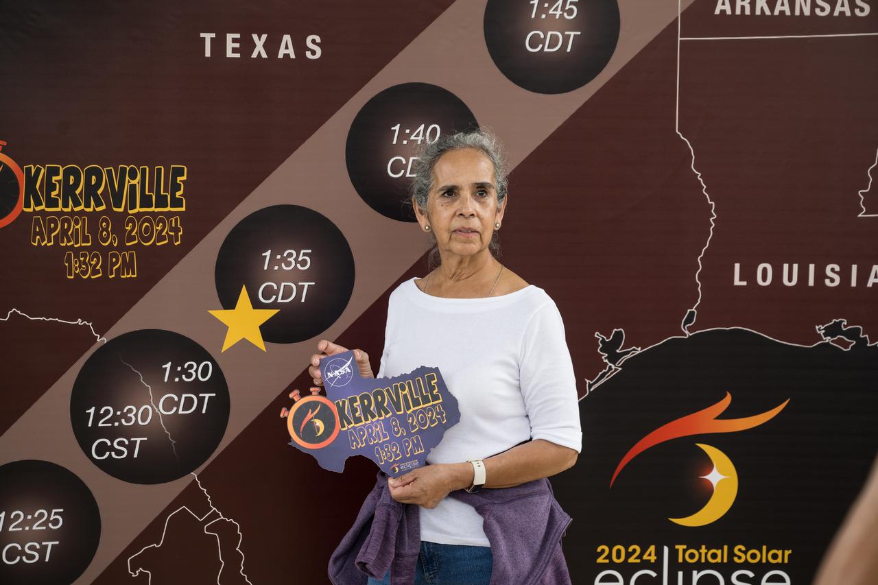 Guests pose for a photo during the Kerrville eclipse festival in Kerrville, TX on Monday, April 8, 2024. A total solar eclipse swept across a narrow portion of the North American continent from Mexico’s Pacific coast to the Atlantic coast of Newfoundland, Canada. A partial solar eclipse was visible across the entire North American continent along with parts of Central America and Europe.  Photo Credit: (NASA/Aubrey Gemignani)