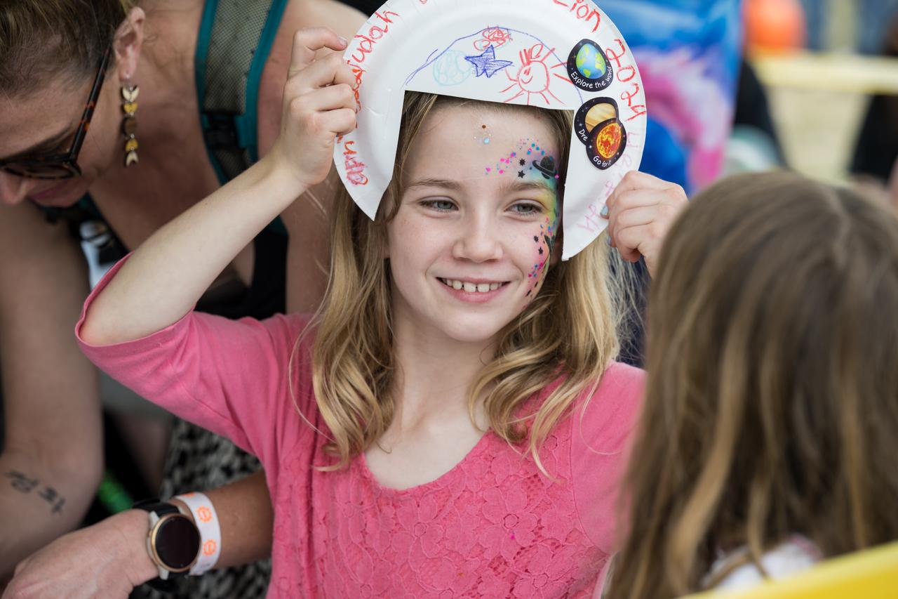 Guests work on art projects during the Kerrville eclipse festival in Kerrville, TX on Monday, April 8, 2024. A total solar eclipse swept across a narrow portion of the North American continent from Mexico’s Pacific coast to the Atlantic coast of Newfoundland, Canada. A partial solar eclipse was visible across the entire North American continent along with parts of Central America and Europe.  Photo Credit: (NASA/Aubrey Gemignani)