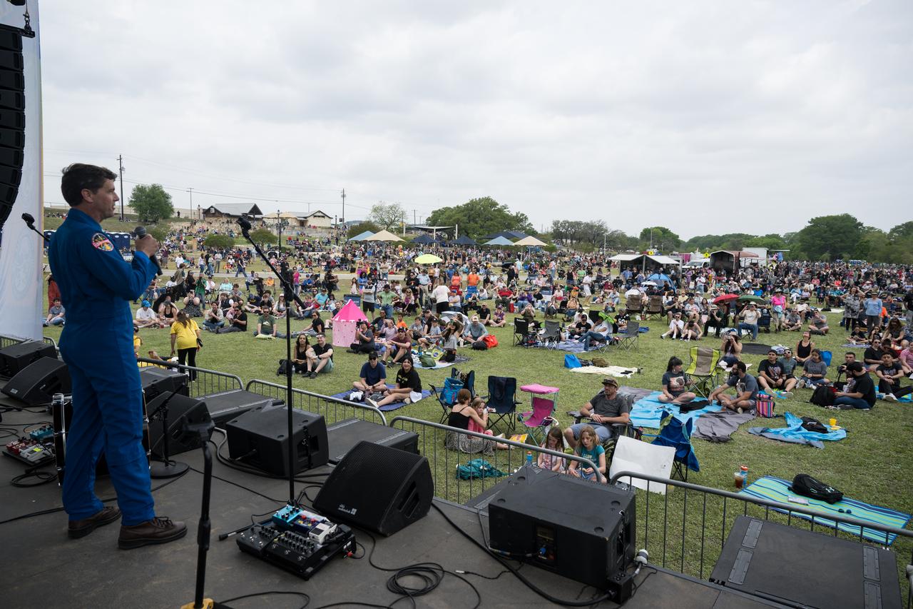 Astronaut Reid Wiseman speaks on the main stage at the Kerrville eclipse festival in Kerrville, TX on Monday, April 8, 2024. A total solar eclipse swept across a narrow portion of the North American continent from Mexico’s Pacific coast to the Atlantic coast of Newfoundland, Canada. A partial solar eclipse was visible across the entire North American continent along with parts of Central America and Europe.  Photo Credit: (NASA/Aubrey Gemignani)