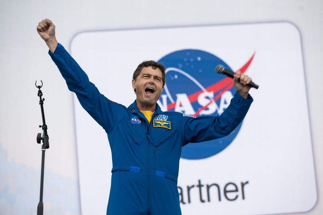 Astronaut Reid Wiseman speaks on the main stage at the Kerrville eclipse festival in Kerrville, TX on Monday, April 8, 2024. A total solar eclipse swept across a narrow portion of the North American continent from Mexico’s Pacific coast to the Atlantic coast of Newfoundland, Canada. A partial solar eclipse was visible across the entire North American continent along with parts of Central America and Europe.  Photo Credit: (NASA/Aubrey Gemignani)