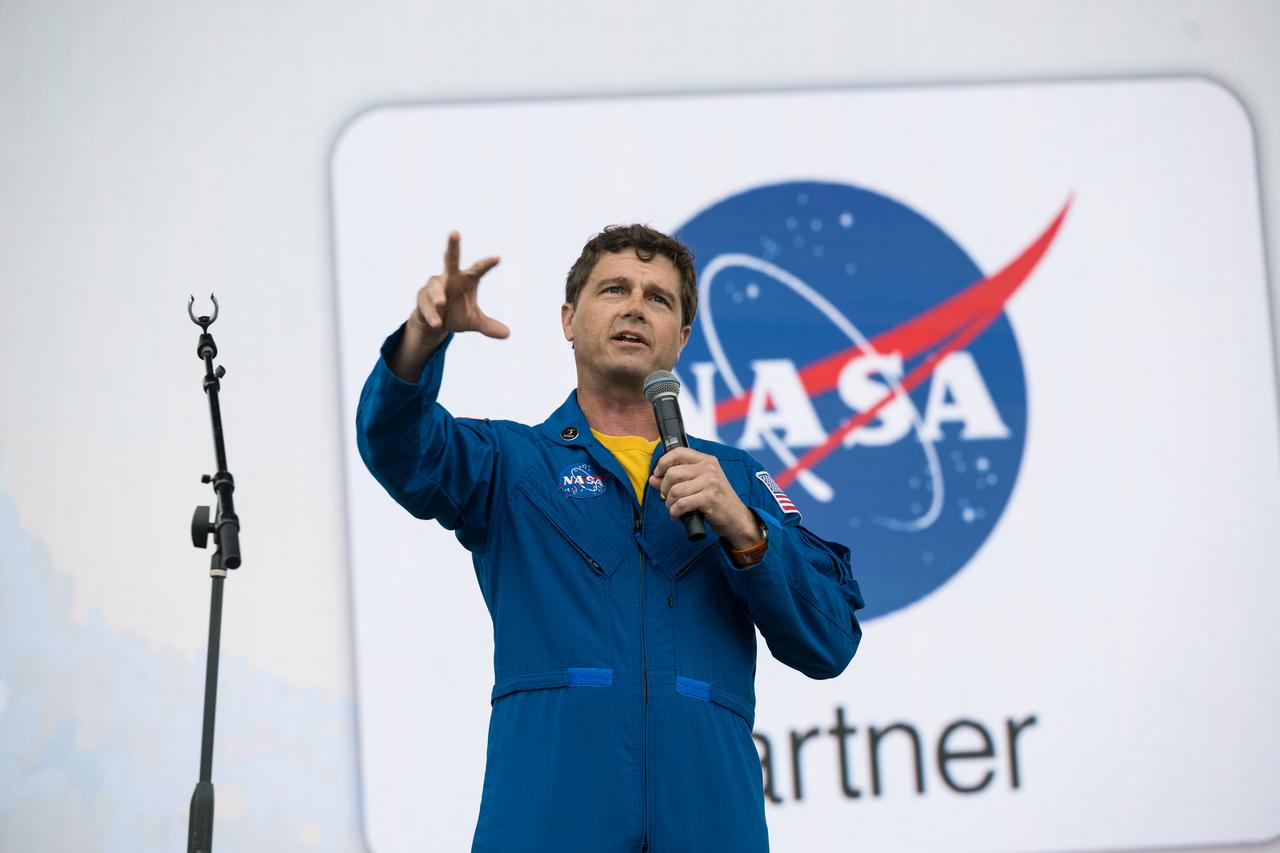 Astronaut Reid Wiseman speaks on the main stage at the Kerrville eclipse festival in Kerrville, TX on Monday, April 8, 2024. A total solar eclipse swept across a narrow portion of the North American continent from Mexico’s Pacific coast to the Atlantic coast of Newfoundland, Canada. A partial solar eclipse was visible across the entire North American continent along with parts of Central America and Europe.  Photo Credit: (NASA/Aubrey Gemignani)