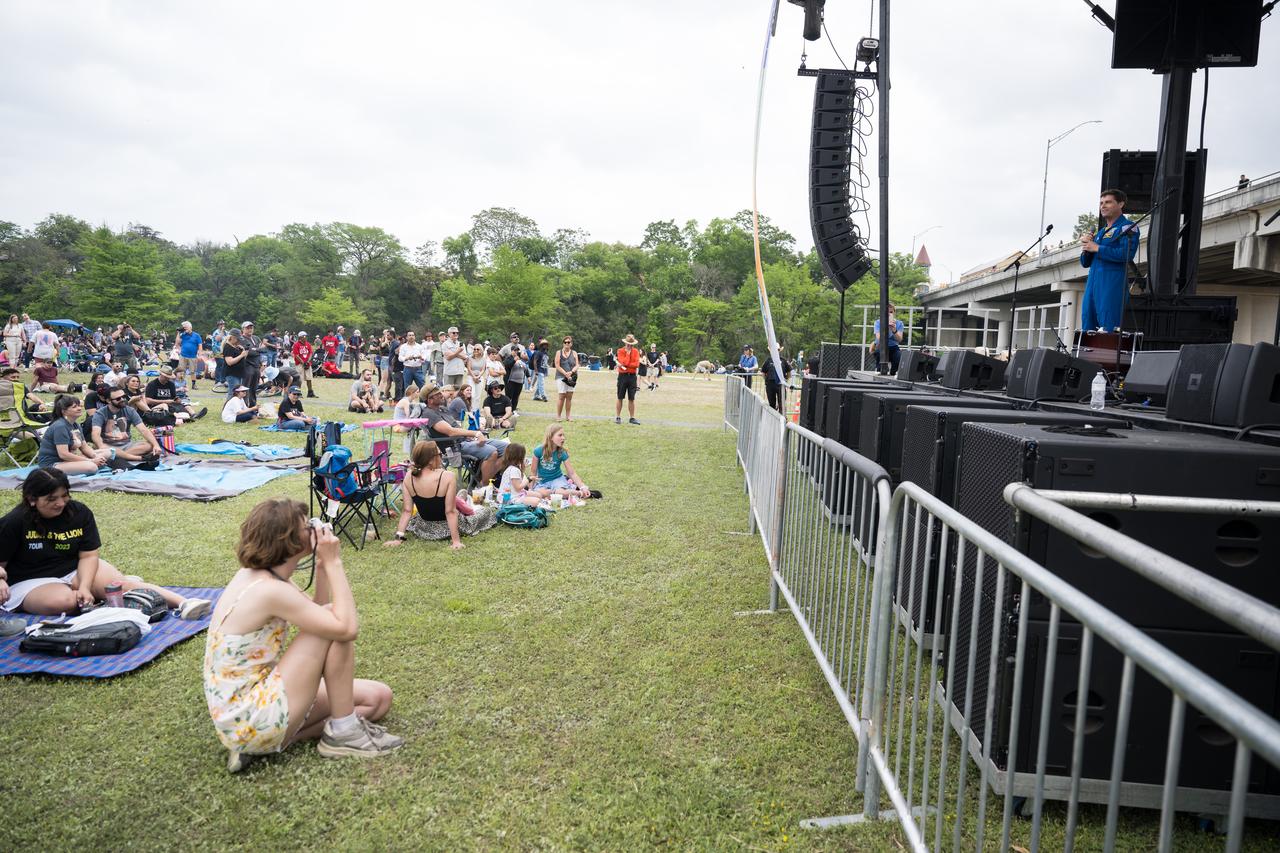 Astronaut Reid Wiseman speaks on the main stage at the Kerrville eclipse festival in Kerrville, TX on Monday, April 8, 2024. A total solar eclipse swept across a narrow portion of the North American continent from Mexico’s Pacific coast to the Atlantic coast of Newfoundland, Canada. A partial solar eclipse was visible across the entire North American continent along with parts of Central America and Europe.  Photo Credit: (NASA/Aubrey Gemignani)