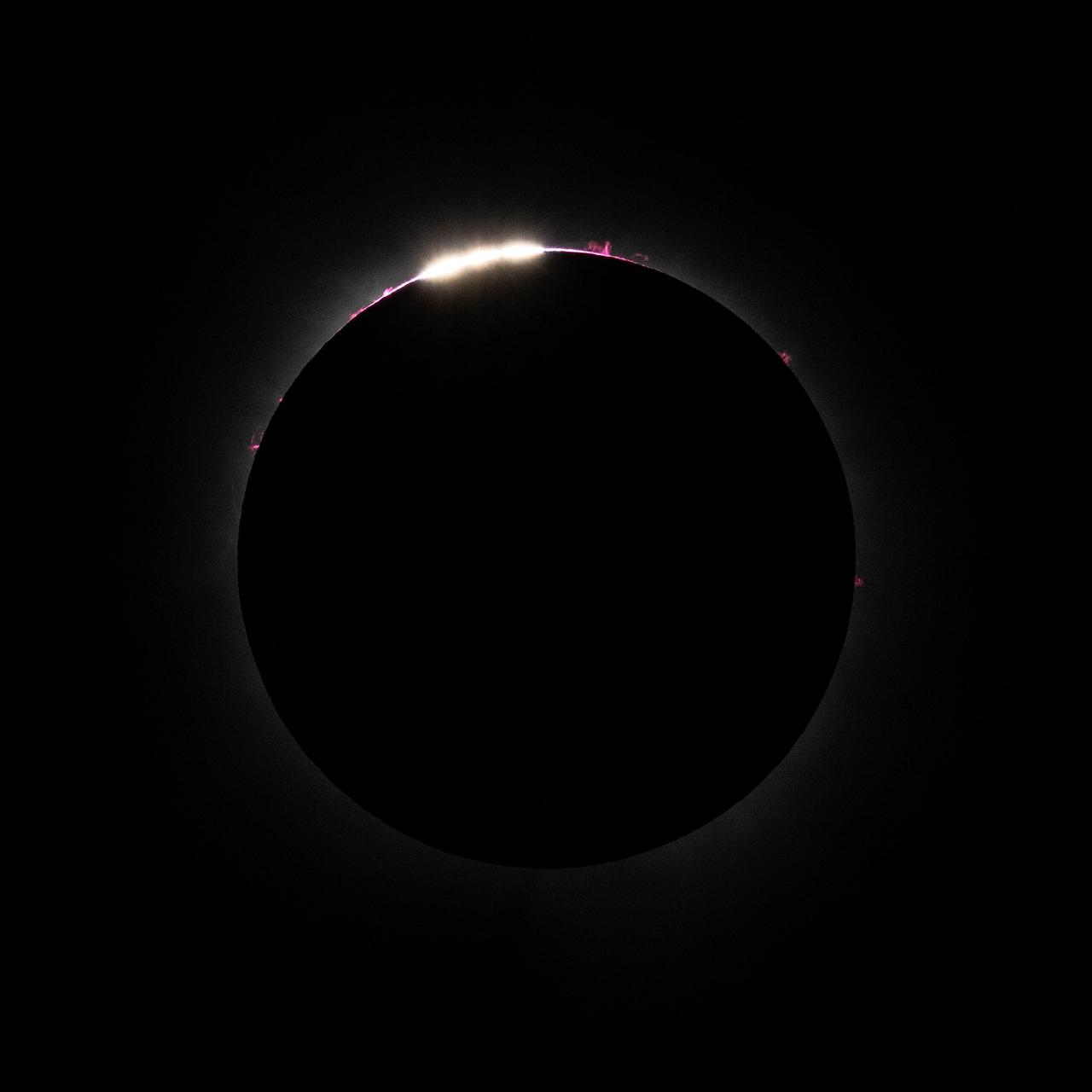 Bailey's Beads are seen just before totality in Dallas, Texas on Monday, April 8, 2024. A total solar eclipse swept across a narrow portion of the North American continent from Mexico’s Pacific coast to the Atlantic coast of Newfoundland, Canada. A partial solar eclipse was visible across the entire North American continent along with parts of Central America and Europe. Photo Credit: (NASA/Keegan Barber)