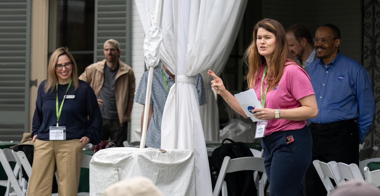NASA Deputy Associate Administrator Casey Swails speaks to guests about the upcoming total solar eclipse at the Dallas Arboretum, Monday, April 8, 2024, in Dallas, Texas. A total solar eclipse swept across a narrow portion of the North American continent from Mexico’s Pacific coast to the Atlantic coast of Newfoundland, Canada. A partial solar eclipse was visible across the entire North American continent along with parts of Central America and Europe. Photo Credit: (NASA/Keegan Barber)