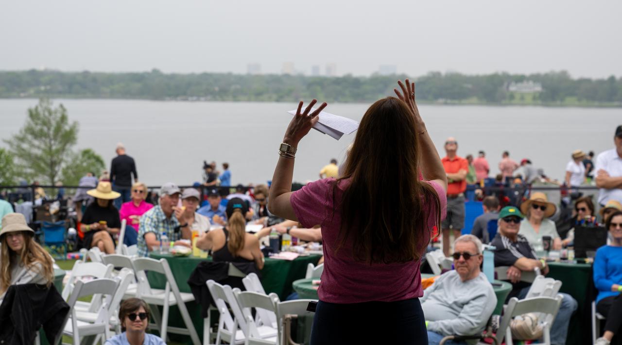 NASA Deputy Associate Administrator Casey Swails speaks to guests about the upcoming total solar eclipse at the Dallas Arboretum, Monday, April 8, 2024, in Dallas, Texas. A total solar eclipse swept across a narrow portion of the North American continent from Mexico’s Pacific coast to the Atlantic coast of Newfoundland, Canada. A partial solar eclipse was visible across the entire North American continent along with parts of Central America and Europe. Photo Credit: (NASA/Keegan Barber)