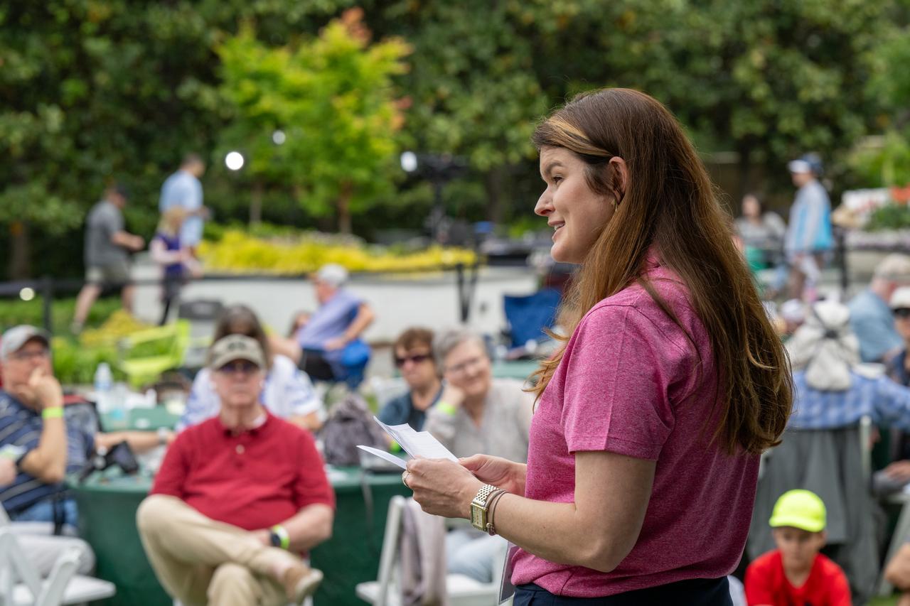 NASA Deputy Associate Administrator Casey Swails speaks to guests about the upcoming total solar eclipse at the Dallas Arboretum, Monday, April 8, 2024, in Dallas, Texas. A total solar eclipse swept across a narrow portion of the North American continent from Mexico’s Pacific coast to the Atlantic coast of Newfoundland, Canada. A partial solar eclipse was visible across the entire North American continent along with parts of Central America and Europe. Photo Credit: (NASA/Keegan Barber)