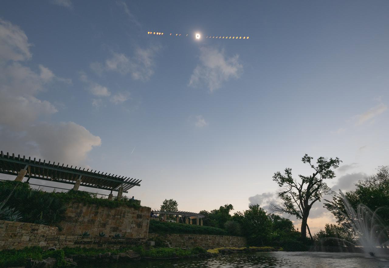 This composite image of multiple exposures shows the progression of a total solar eclipse in Dallas, Texas on Monday, April 8, 2024. A total solar eclipse swept across a narrow portion of the North American continent from Mexico’s Pacific coast to the Atlantic coast of Newfoundland, Canada. A partial solar eclipse was visible across the entire North American continent along with parts of Central America and Europe. Photo Credit: (NASA/Keegan Barber)