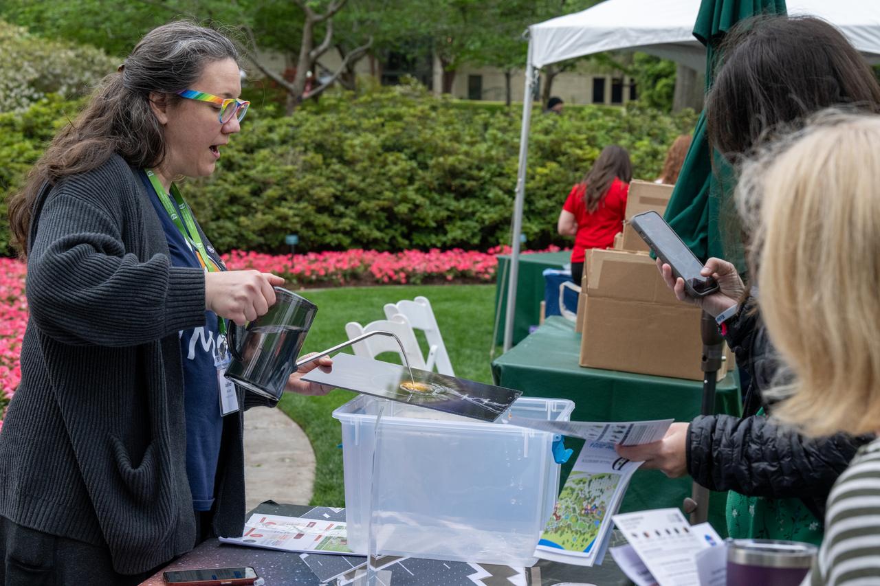 Guests learn about the total solar eclipse from NASA staff at the Dallas Arboretum, Monday, April 8, 2024, in Dallas, Texas. A total solar eclipse swept across a narrow portion of the North American continent from Mexico’s Pacific coast to the Atlantic coast of Newfoundland, Canada. A partial solar eclipse was visible across the entire North American continent along with parts of Central America and Europe. Photo Credit: (NASA/Keegan Barber) in Dallas, Texas on Monday, April 8, 2024. A total solar eclipse swept across a narrow portion of the North American continent from Mexico’s Pacific coast to the Atlantic coast of Newfoundland, Canada. A partial solar eclipse was visible across the entire North American continent along with parts of Central America and Europe. Photo Credit: (NASA/Keegan Barber)