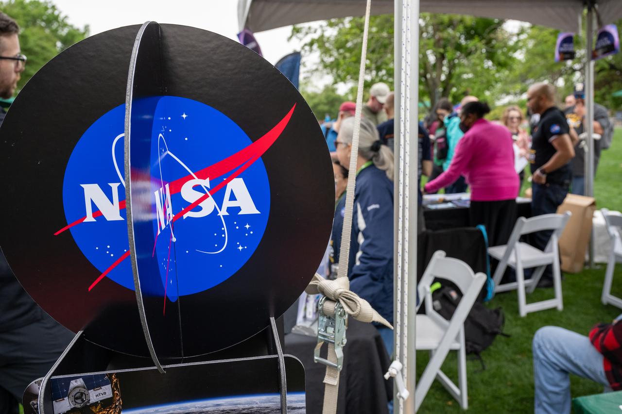 Guests learn about the total solar eclipse from NASA staff at the Dallas Arboretum, Monday, April 8, 2024, in Dallas, Texas. A total solar eclipse swept across a narrow portion of the North American continent from Mexico’s Pacific coast to the Atlantic coast of Newfoundland, Canada. A partial solar eclipse was visible across the entire North American continent along with parts of Central America and Europe. Photo Credit: (NASA/Keegan Barber) in Dallas, Texas on Monday, April 8, 2024. A total solar eclipse swept across a narrow portion of the North American continent from Mexico’s Pacific coast to the Atlantic coast of Newfoundland, Canada. A partial solar eclipse was visible across the entire North American continent along with parts of Central America and Europe. Photo Credit: (NASA/Keegan Barber)