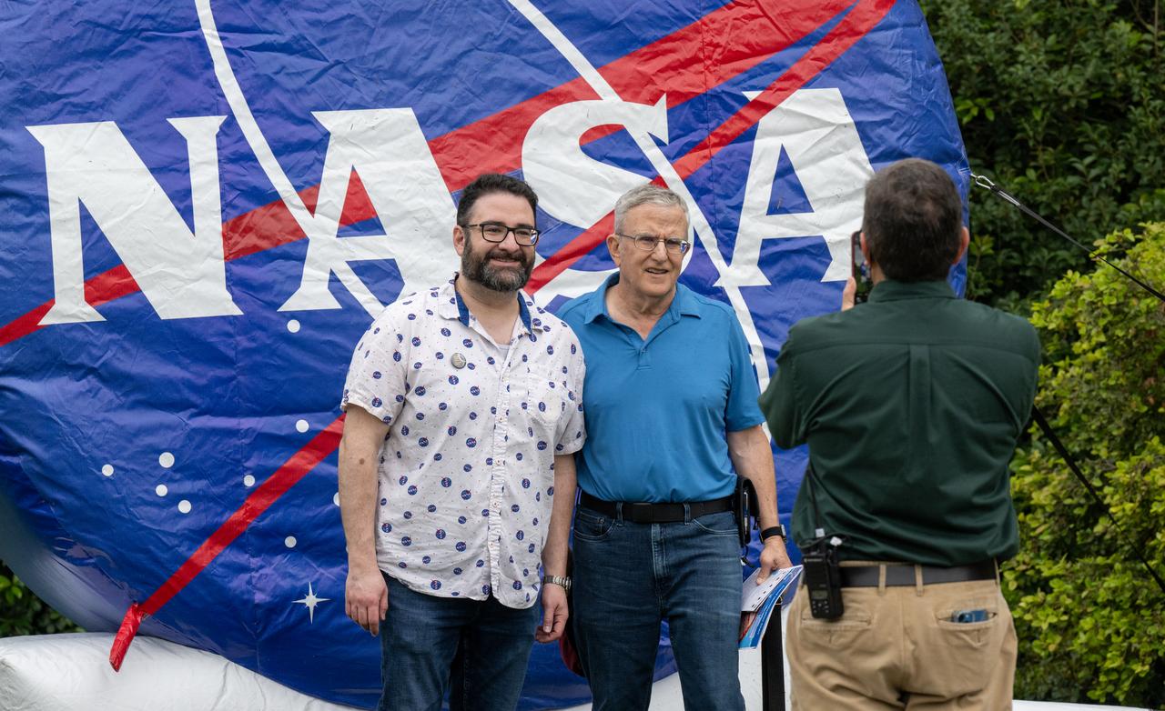 Guests pose for a photo at the Dallas Arboretum, Monday, April 8, 2024, in Dallas, Texas. A total solar eclipse swept across a narrow portion of the North American continent from Mexico’s Pacific coast to the Atlantic coast of Newfoundland, Canada. A partial solar eclipse was visible across the entire North American continent along with parts of Central America and Europe. Photo Credit: (NASA/Keegan Barber) in Dallas, Texas on Monday, April 8, 2024. A total solar eclipse swept across a narrow portion of the North American continent from Mexico’s Pacific coast to the Atlantic coast of Newfoundland, Canada. A partial solar eclipse was visible across the entire North American continent along with parts of Central America and Europe. Photo Credit: (NASA/Keegan Barber)