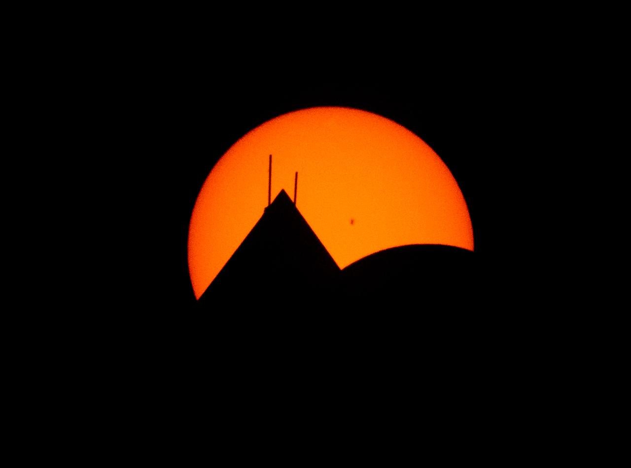 The Moon, lower right, is seen passing in front of the Sun, with the top of the Washington Monument in silhouette, during a partial solar eclipse in Washington, on Monday, April 8, 2024. A total solar eclipse swept across a narrow portion of the North American continent from Mexico’s Pacific coast to the Atlantic coast of Newfoundland, Canada. A partial solar eclipse was visible across the entire North American continent along with parts of Central America and Europe.  Photo Credit: (NASA/Bill Ingalls)
