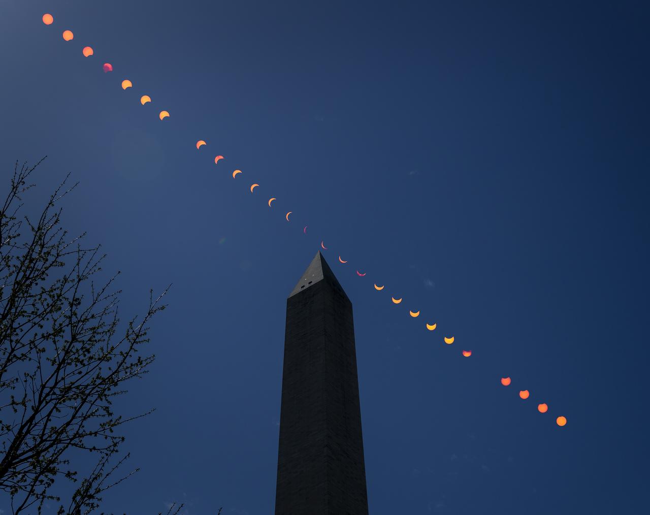 This composite image of multiple exposures shows the progression of a partial solar eclipse over the Washington Monument, Monday, April 8, 2024, in Washington. A total solar eclipse swept across a narrow portion of the North American continent from Mexico’s Pacific coast to the Atlantic coast of Newfoundland, Canada. A partial solar eclipse was visible across the entire North American continent along with parts of Central America and Europe.  Photo Credit: (NASA/Bill Ingalls)