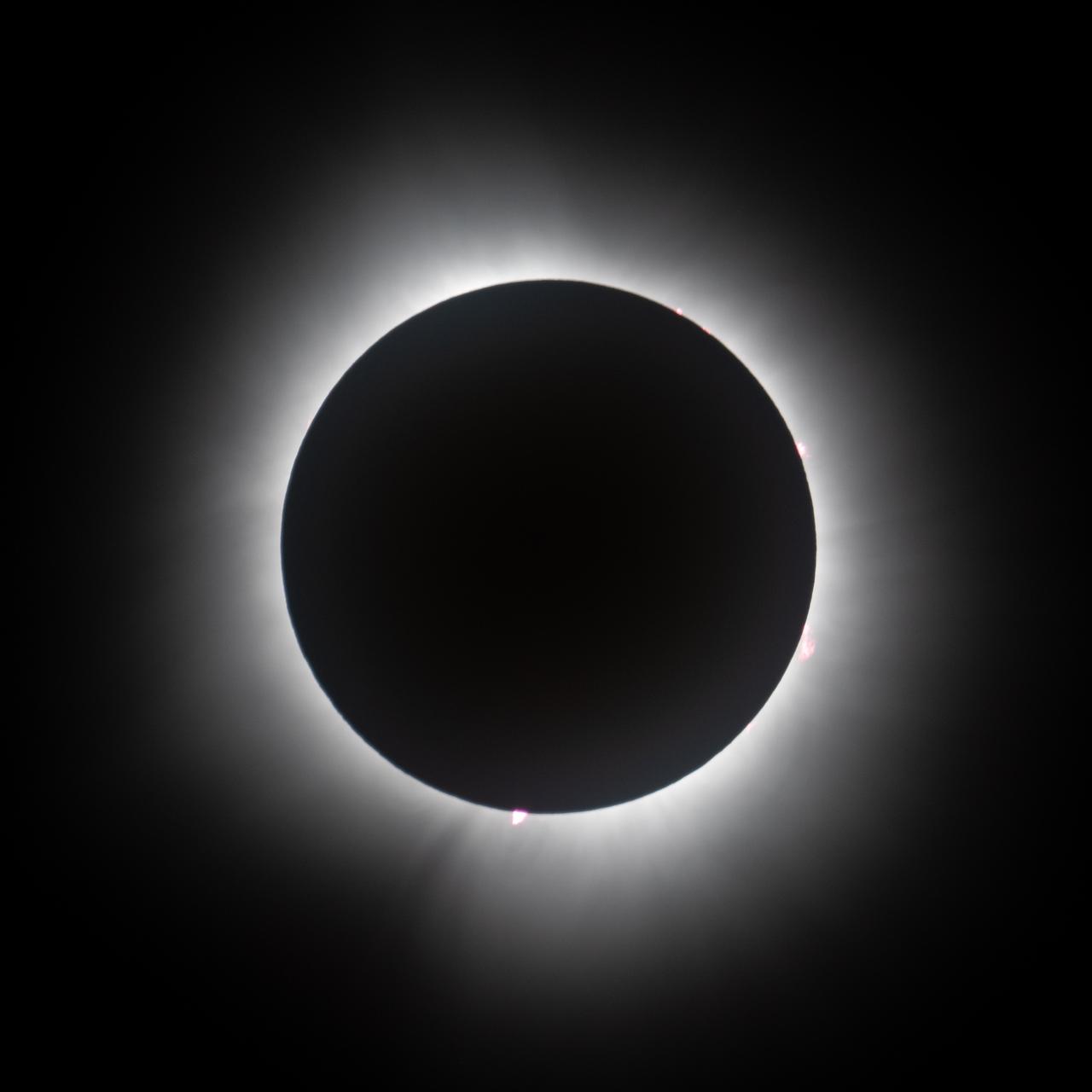 A total solar eclipse is seen from the Indianapolis Motor Speedway, Monday, April 8, 2024, in Indianapolis, Indiana. A total solar eclipse swept across a narrow portion of the North American continent from Mexico’s Pacific coast to the Atlantic coast of Newfoundland, Canada. A partial solar eclipse was visible across the entire North American continent along with parts of Central America and Europe.  Photo Credit: (NASA/Joel Kowsky)