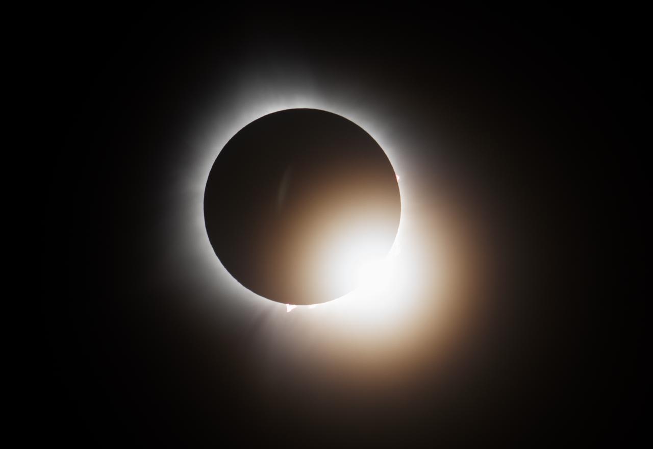 A total solar eclipse is seen from the Indianapolis Motor Speedway, Monday, April 8, 2024, in Indianapolis, Indiana. A total solar eclipse swept across a narrow portion of the North American continent from Mexico’s Pacific coast to the Atlantic coast of Newfoundland, Canada. A partial solar eclipse was visible across the entire North American continent along with parts of Central America and Europe.  Photo Credit: (NASA/Joel Kowsky)