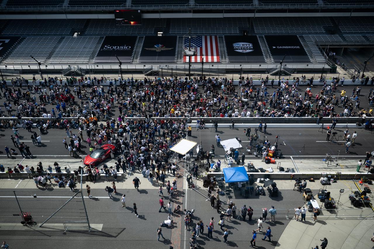 Attendees are seen on the track at at the Indianapolis Motor Speedway as they watch the progression of a total solar eclipse, Monday, April 8, 2024, in Indianapolis, Indiana. A total solar eclipse swept across a narrow portion of the North American continent from Mexico’s Pacific coast to the Atlantic coast of Newfoundland, Canada. A partial solar eclipse was visible across the entire North American continent along with parts of Central America and Europe.  Photo Credit: (NASA/Joel Kowsky)