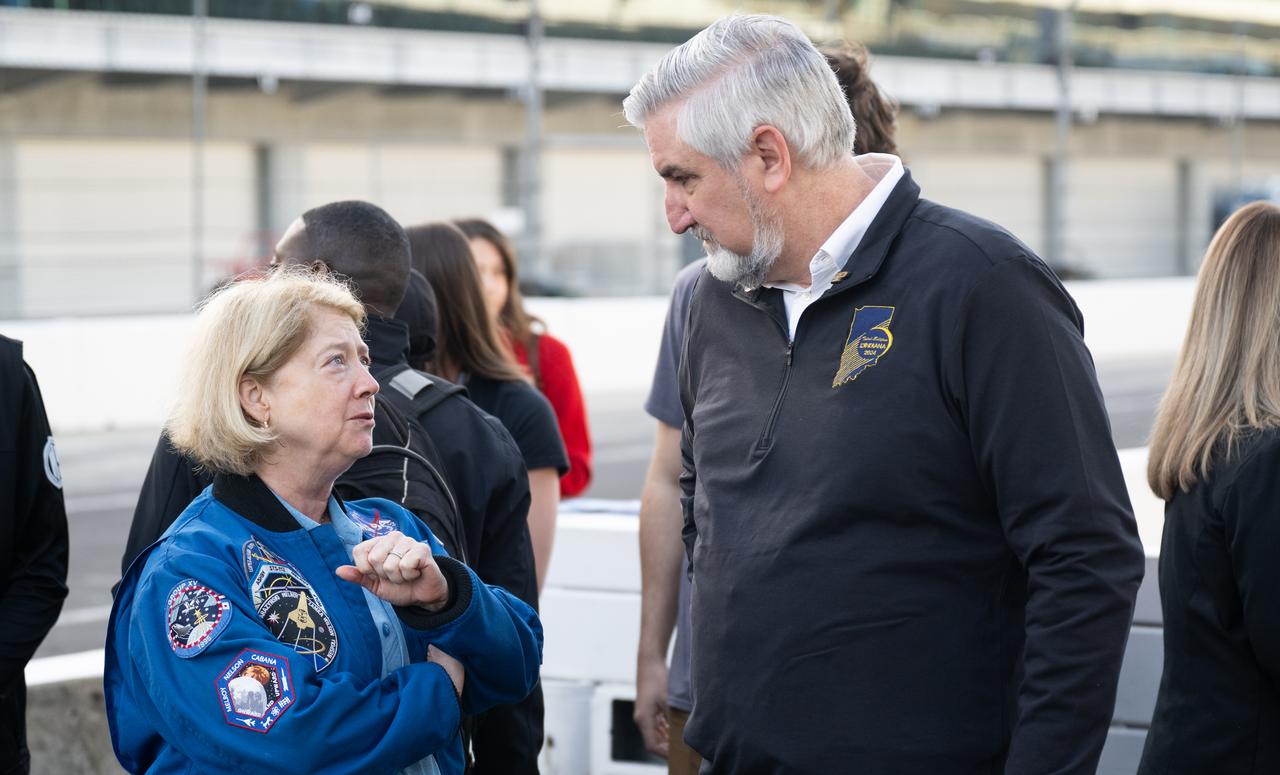 NASA Deputy Administrator Pam Melroy, left, and Indiana Governor Eric Holcomb are seen at the Indianapolis Motor Speedway ahead of a total solar eclipse, Monday, April 8, 2024, in Indianapolis, Ind. A total solar eclipse swept across a narrow portion of the North American continent from Mexico’s Pacific coast to the Atlantic coast of Newfoundland, Canada. A partial solar eclipse was visible across the entire North American continent along with parts of Central America and Europe.  Photo Credit: (NASA/Joel Kowsky)