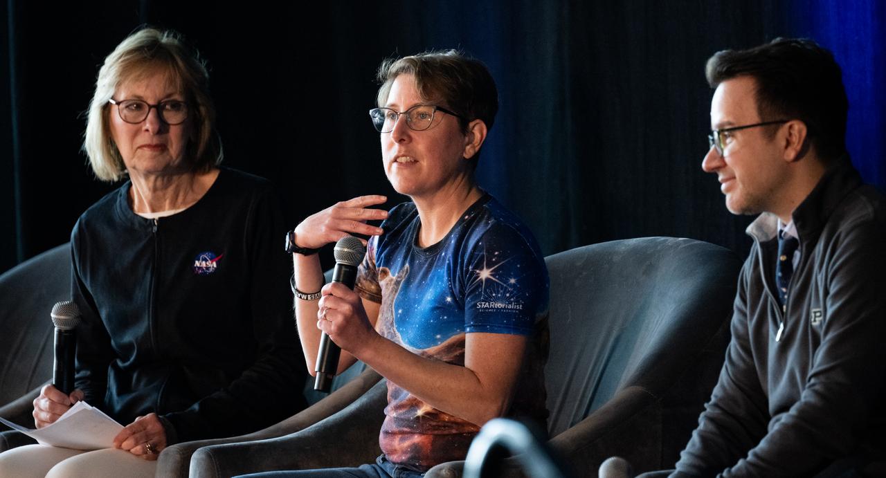 Jane Rigby, senior project scientist for NASA's James Webb Space Telescope, center, is seen alongside Peg Luce, deputy director of the Heliophysics Division of NASA's Science Mission Directorate, left, and Danny Milisavljevic, associate professor of Physics and Astronomy at Purdue University, as she speaks to attendees at the Indianapolis Motor Speedway during a panel discussion about the James Webb Space Telescope ahead of the total solar eclipse, Monday, April 8, 2024, in Indianapolis, Ind. A total solar eclipse swept across a narrow portion of the North American continent from Mexico’s Pacific coast to the Atlantic coast of Newfoundland, Canada. A partial solar eclipse was visible across the entire North American continent along with parts of Central America and Europe.  Photo Credit: (NASA/Joel Kowsky)