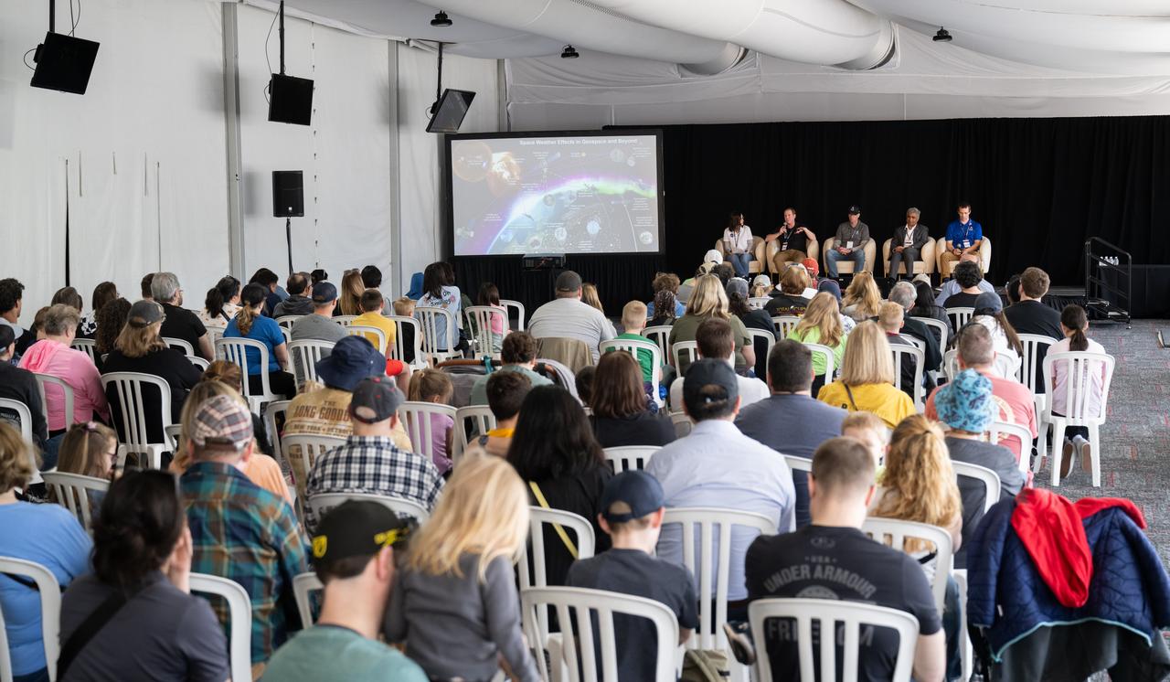Patricia Moore, communications strategist for the Moon to Mars Program Office in NASA's Exploration Systems Development Mission Directorate, Bradley Williams, program executive in the Heliophysics Division of NASA's Science Mission Directorate, Matthew Roper, Crew Health and Medical Team Lead in NASA's Flight Operations Directorate, Arvind Raman, dean of the College of Engineering at Purdue University, and Logan Kennedy, surface lead for Human Landing System Programs in NASA's Exploration Systems Development Mission Directorate, are seen as they speaks to attendees at the Indianapolis Motor Speedway during a panel discussion about following your dreams to a career in STEM ahead of the total solar eclipse, Monday, April 8, 2024, in Indianapolis, Ind. A total solar eclipse swept across a narrow portion of the North American continent from Mexico’s Pacific coast to the Atlantic coast of Newfoundland, Canada. A partial solar eclipse was visible across the entire North American continent along with parts of Central America and Europe.  Photo Credit: (NASA/Joel Kowsky)