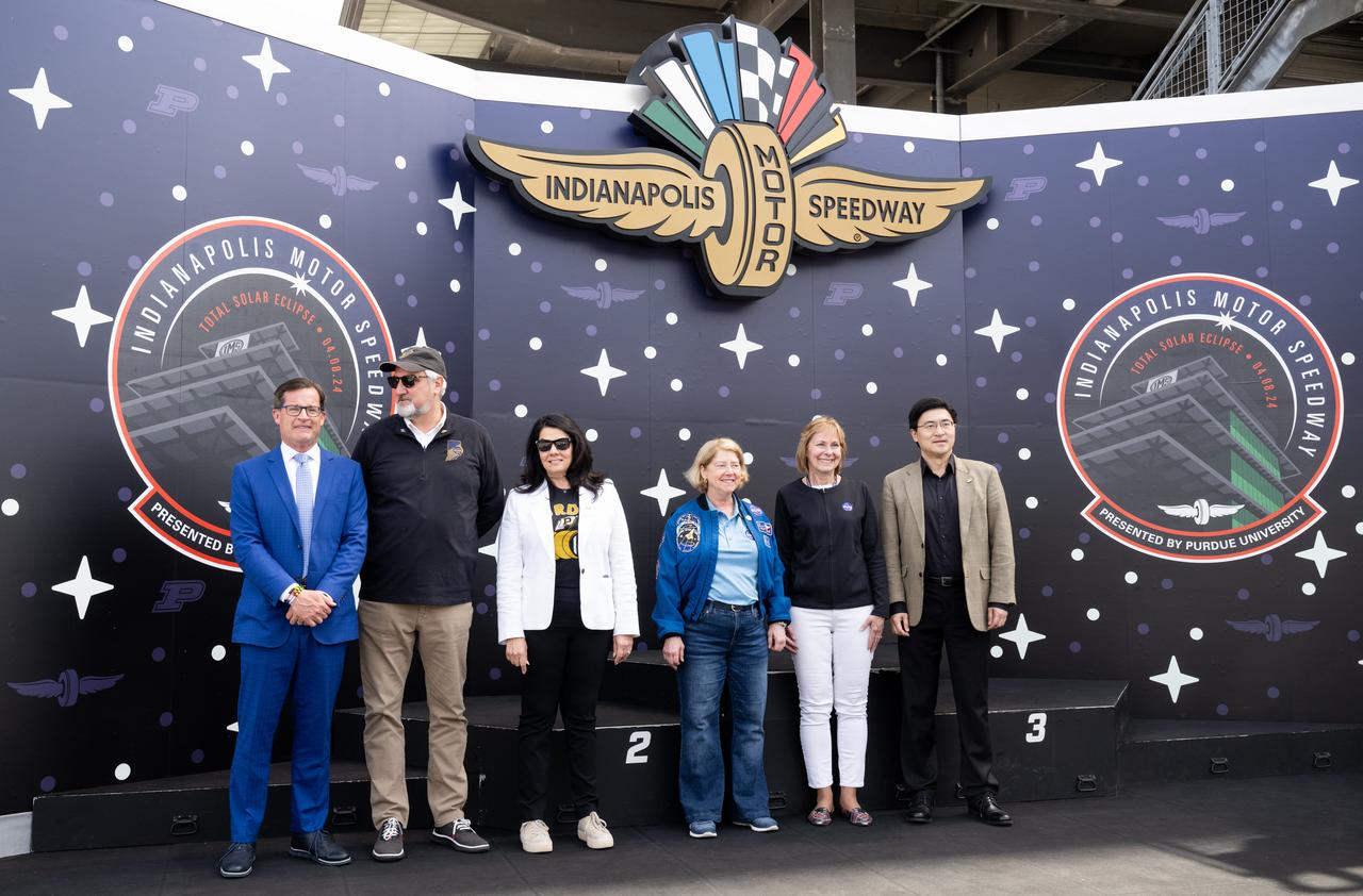 Doug Boles, Indianapolis Motor Speedway President, left, Indiana Gov. Eric Holcomb, Janet Holcomb, Indiana’s First Lady, NASA Deputy Administrator Pam Melroy, Peg Luce, deputy director of the Heliophysics Division of NASA's Science Mission Directorate, and Mung Chiang, President of Purdue University are seen during opening ceremonies at the Indianapolis Motor Speedway ahead of the total solar eclipse, Monday, April 8, 2024, in Indianapolis, Ind. A total solar eclipse swept across a narrow portion of the North American continent from Mexico’s Pacific coast to the Atlantic coast of Newfoundland, Canada. A partial solar eclipse was visible across the entire North American continent along with parts of Central America and Europe.  Photo Credit: (NASA/Joel Kowsky)