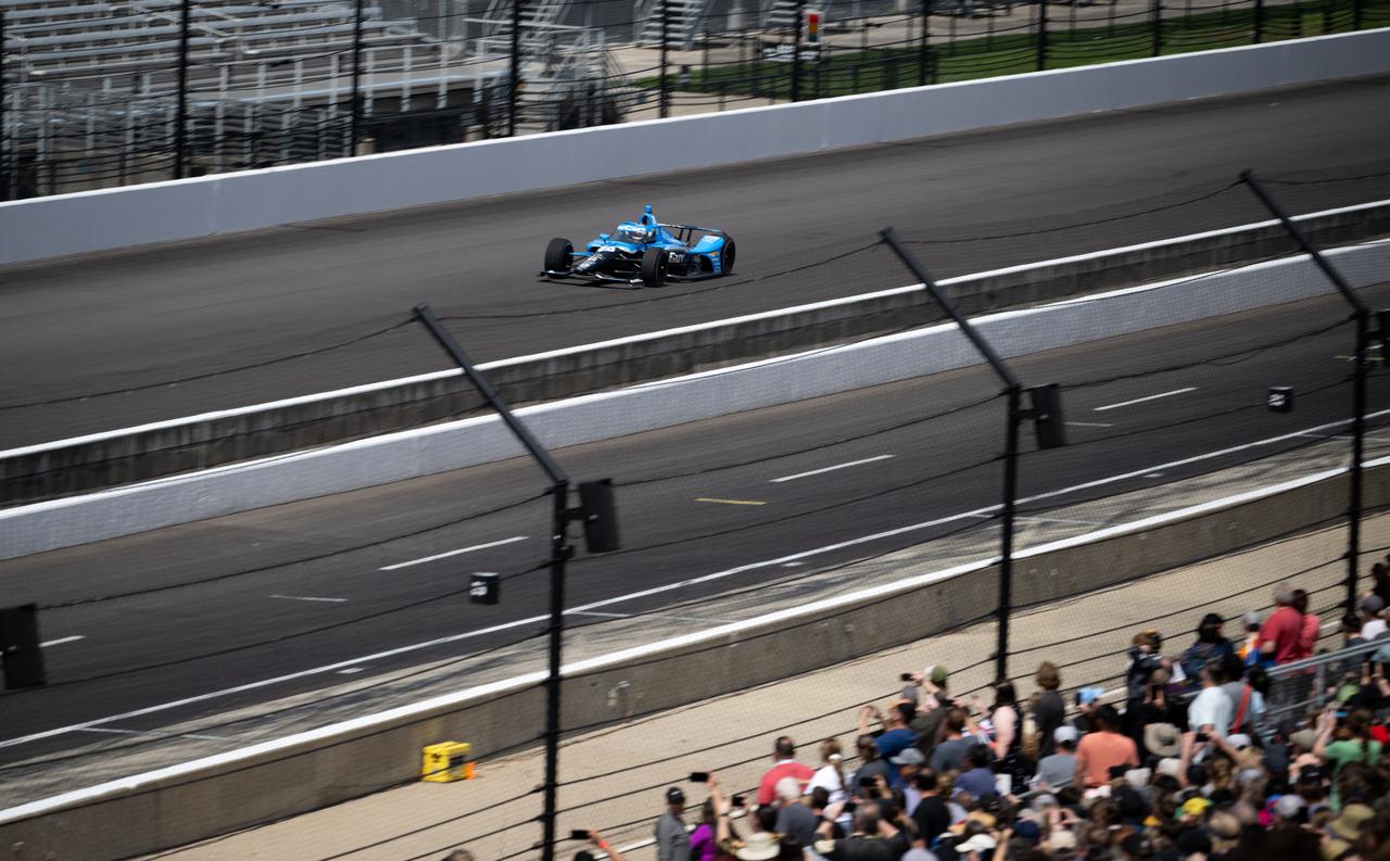 An NTT INDY car is seen as it is driven by Ed Carpenter, around the track following opening ceremonies at the Indianapolis Motor Speedway ahead of the total solar eclipse, Monday, April 8, 2024, in Indianapolis, Ind. A total solar eclipse swept across a narrow portion of the North American continent from Mexico’s Pacific coast to the Atlantic coast of Newfoundland, Canada. A partial solar eclipse was visible across the entire North American continent along with parts of Central America and Europe.  Photo Credit: (NASA/Joel Kowsky)