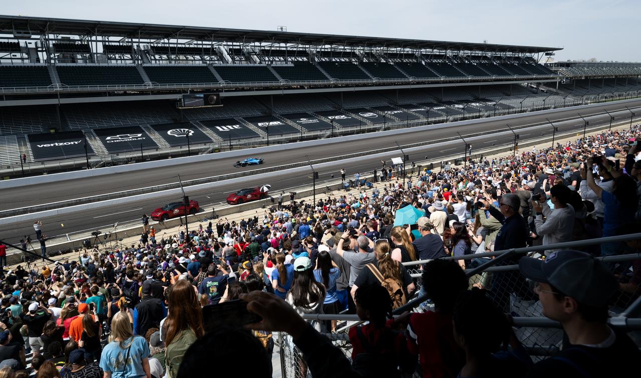 An NTT INDY car is seen as it is driven by Ed Carpenter, around the track following opening ceremonies at the Indianapolis Motor Speedway ahead of the total solar eclipse, Monday, April 8, 2024, in Indianapolis, Ind. A total solar eclipse swept across a narrow portion of the North American continent from Mexico’s Pacific coast to the Atlantic coast of Newfoundland, Canada. A partial solar eclipse was visible across the entire North American continent along with parts of Central America and Europe.  Photo Credit: (NASA/Joel Kowsky)