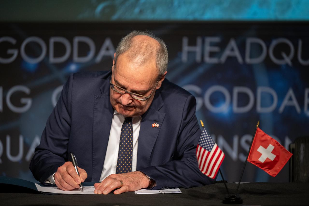 Swiss Federal Councillor Guy Parmelin signs the Artemis Accords, Monday, April 15, 2024, at the Mary W. Jackson NASA Headquarters building in Washington. Switzerland is the 37th country to sign the Artemis Accords, which establish a practical set of principles to guide space exploration cooperation among nations participating in NASA’s Artemis program. Photo Credit: (NASA/Keegan Barber)