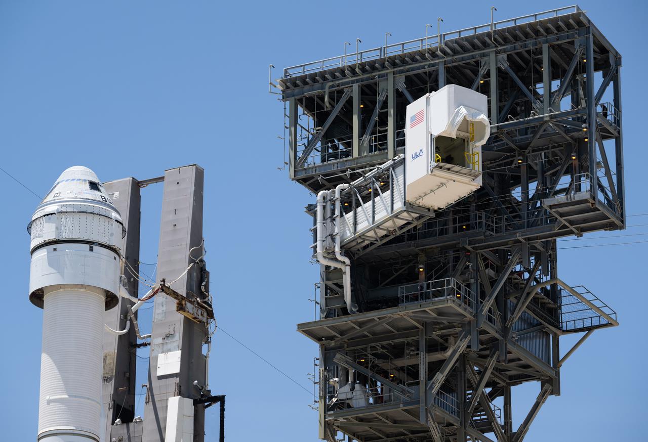 The crew access arm is seen as it is swung into position after a United Launch Alliance Atlas V rocket with Boeing’s CST-100 Starliner spacecraft aboard was rolled out of the Vertical Integration Facility to the launch pad at Space Launch Complex 41 ahead of the NASA’s Boeing Crew Flight Test, Saturday, May 4, 2024 at Cape Canaveral Space Force Station in Florida. NASA’s Boeing Crew Flight Test is the first launch with astronauts aboard the Starliner spacecraft and Atlas V rocket to the International Space Station as part of the agency’s Commercial Crew Program. The flight test, targeted for launch at 10:34 p.m. EDT on Monday, May 6, serves as an end-to-end demonstration of Boeing’s crew transportation system and will carry NASA astronauts Butch Wilmore and Suni Williams to and from the orbiting laboratory. Photo Credit: (NASA/Joel Kowsky)