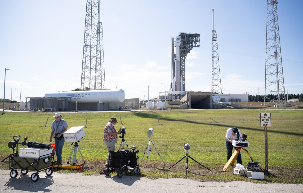 A United Launch Alliance Atlas V rocket with Boeing’s CST-100 Starliner spacecraft aboard is seen on the launch pad at Space Launch Complex 41 as members of the media setup remote cameras ahead of the NASA’s Boeing Crew Flight Test, Sunday, May 5, 2024 at Cape Canaveral Space Force Station in Florida. NASA’s Boeing Crew Flight Test is the first launch with astronauts of the Boeing CFT-100 spacecraft and United Launch Alliance Atlas V rocket to the International Space Station as part of the agency’s Commercial Crew Program. The flight test, targeted for launch at 10:34 p.m. EDT on Monday, May 6, serves as an end-to-end demonstration of Boeing’s crew transportation system and will carry NASA astronauts Butch Wilmore and Suni Williams to and from the orbiting laboratory. Photo Credit: (NASA/Joel Kowsky)