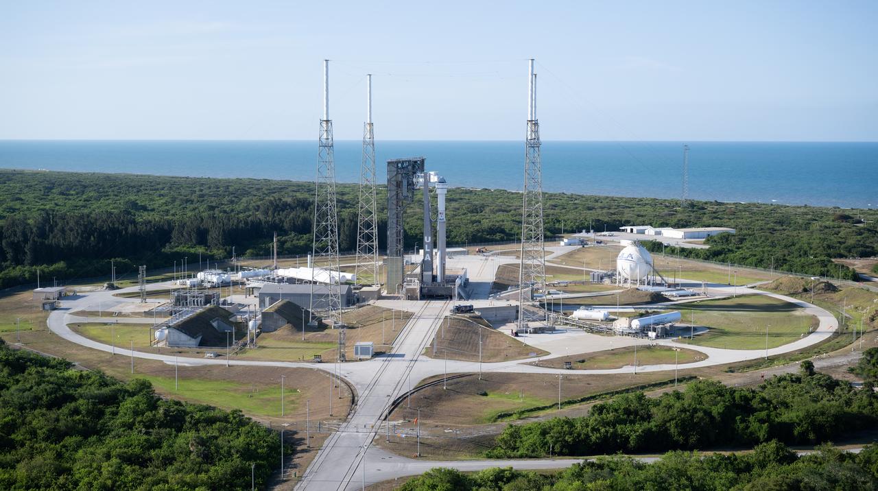 A United Launch Alliance Atlas V rocket with Boeing’s CST-100 Starliner spacecraft aboard is seen on the launch pad at Space Launch Complex 41 ahead of the NASA’s Boeing Crew Flight Test, Sunday, May 5, 2024 at Cape Canaveral Space Force Station in Florida. NASA’s Boeing Crew Flight Test is the first launch with astronauts of the Boeing CFT-100 spacecraft and United Launch Alliance Atlas V rocket to the International Space Station as part of the agency’s Commercial Crew Program. The flight test, targeted for launch at 10:34 p.m. EDT on Monday, May 6, serves as an end-to-end demonstration of Boeing’s crew transportation system and will carry NASA astronauts Butch Wilmore and Suni Williams to and from the orbiting laboratory. Photo Credit: (NASA/Joel Kowsky)