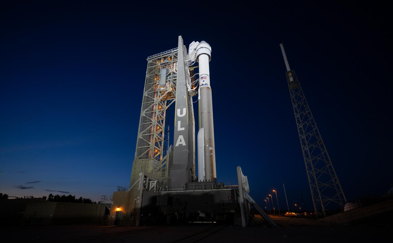 A United Launch Alliance Atlas V rocket with Boeing’s CST-100 Starliner spacecraft aboard is seen on the launch pad illuminated by spotlights at Space Launch Complex 41 ahead of the NASA’s Boeing Crew Flight Test, Sunday, May 5, 2024 at Cape Canaveral Space Force Station in Florida. NASA’s Boeing Crew Flight Test is the first launch with astronauts of the Boeing CFT-100 spacecraft and United Launch Alliance Atlas V rocket to the International Space Station as part of the agency’s Commercial Crew Program. The flight test, targeted for launch at 10:34 p.m. EDT on Monday, May 6, serves as an end-to-end demonstration of Boeing’s crew transportation system and will carry NASA astronauts Butch Wilmore and Suni Williams to and from the orbiting laboratory. Photo Credit: (NASA/Joel Kowsky)