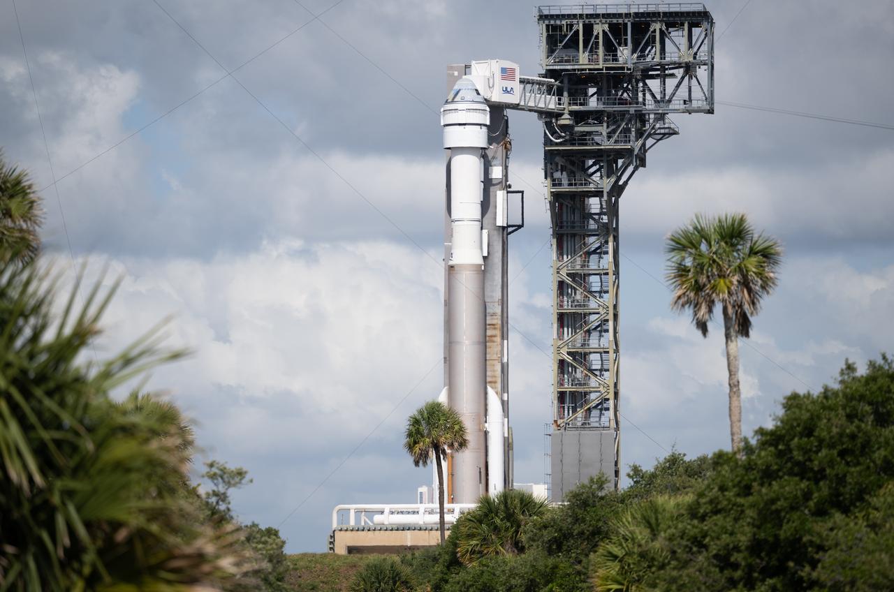 A United Launch Alliance Atlas V rocket with Boeing’s CST-100 Starliner spacecraft aboard is seen on the launch pad at Space Launch Complex 41 ahead of the NASA’s Boeing Crew Flight Test, Monday, May 6, 2024 at Cape Canaveral Space Force Station in Florida. NASA’s Boeing Crew Flight Test is the first launch with astronauts of the Boeing CFT-100 spacecraft and United Launch Alliance Atlas V rocket to the International Space Station as part of the agency’s Commercial Crew Program. The flight test, targeted for launch at 10:34 p.m. EDT on Monday, May 6, serves as an end-to-end demonstration of Boeing’s crew transportation system and will carry NASA astronauts Butch Wilmore and Suni Williams to and from the orbiting laboratory. Photo Credit: (NASA/Joel Kowsky)