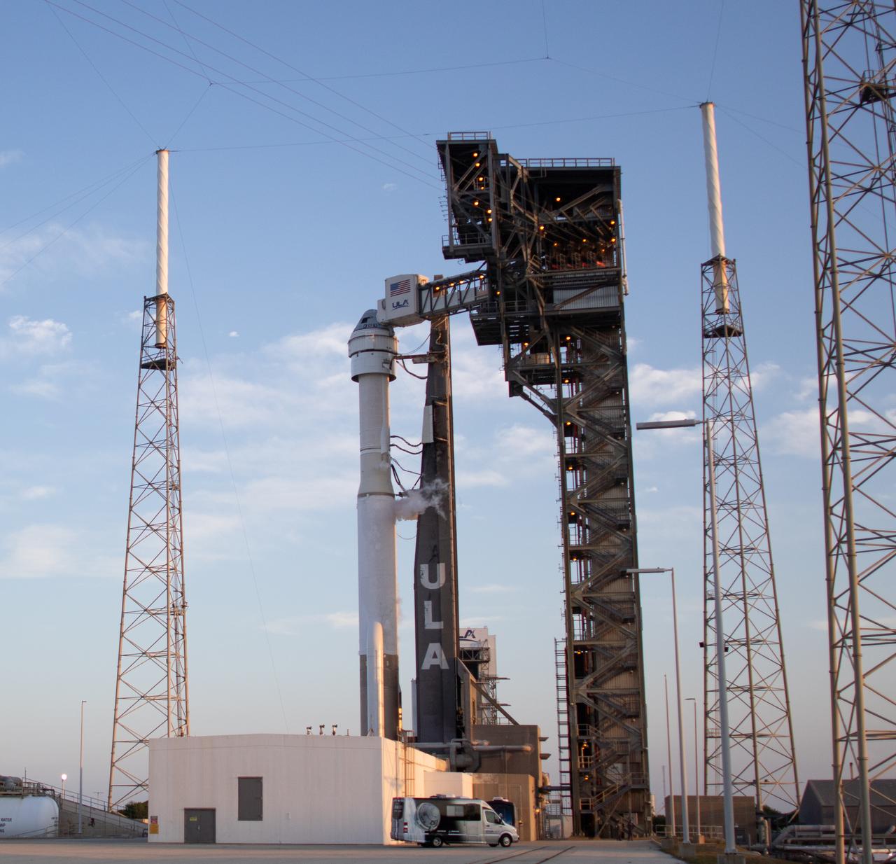 The crew transportation vehicle carrying NASA astronauts Butch Wilmore and Suni Williams is seen as it arrives at launch pad at Space Launch Complex 41 before the first launch attempt of NASA’s Boeing Crew Flight Test was scrubbed, Monday, May 6, 2024 at Cape Canaveral Space Force Station in Florida. NASA’s Boeing Crew Flight Test is the first launch with astronauts of the Boeing CFT-100 spacecraft and United Launch Alliance Atlas V rocket to the International Space Station as part of the agency’s Commercial Crew Program. The flight test, next targeted for no earlier than Friday, May 10, serves as an end-to-end demonstration of Boeing’s crew transportation system and will carry NASA astronauts Butch Wilmore and Suni Williams to and from the orbiting laboratory. Photo Credit: (NASA/Joel Kowsky)