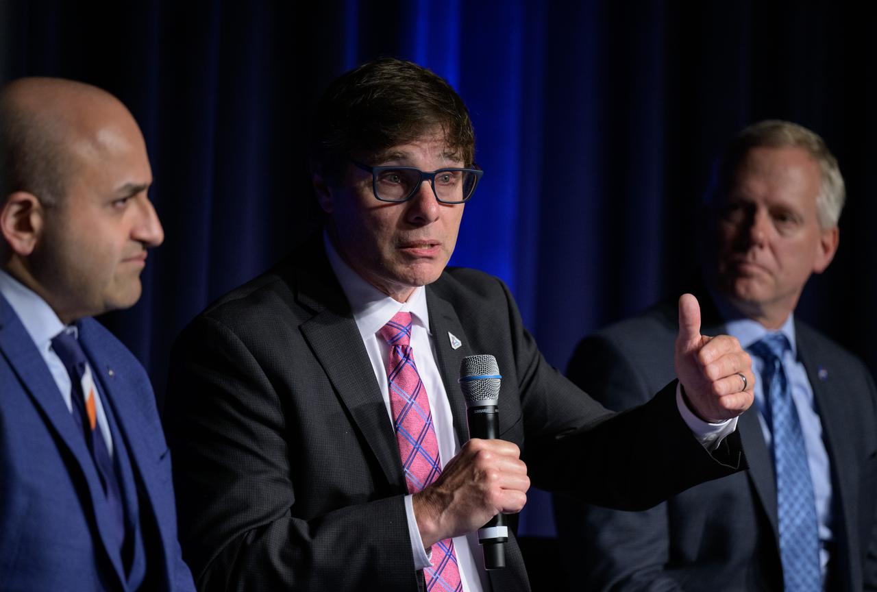 NASA Chief Artificial Intelligence Officer David Salvagnini gives remarks in a NASA employee town hall on how the agency is using and developing Artificial Intelligence (AI) tools to advance missions and research, as NASA Chief Technologist A.C. Charania, left and NASA Chief Information Officer Jeff Seaton, right, look on, Wednesday, May 22, 2024, at the NASA Headquarters Mary W. Jackson Building in Washington. Photo Credit: (NASA/Bill Ingalls)
