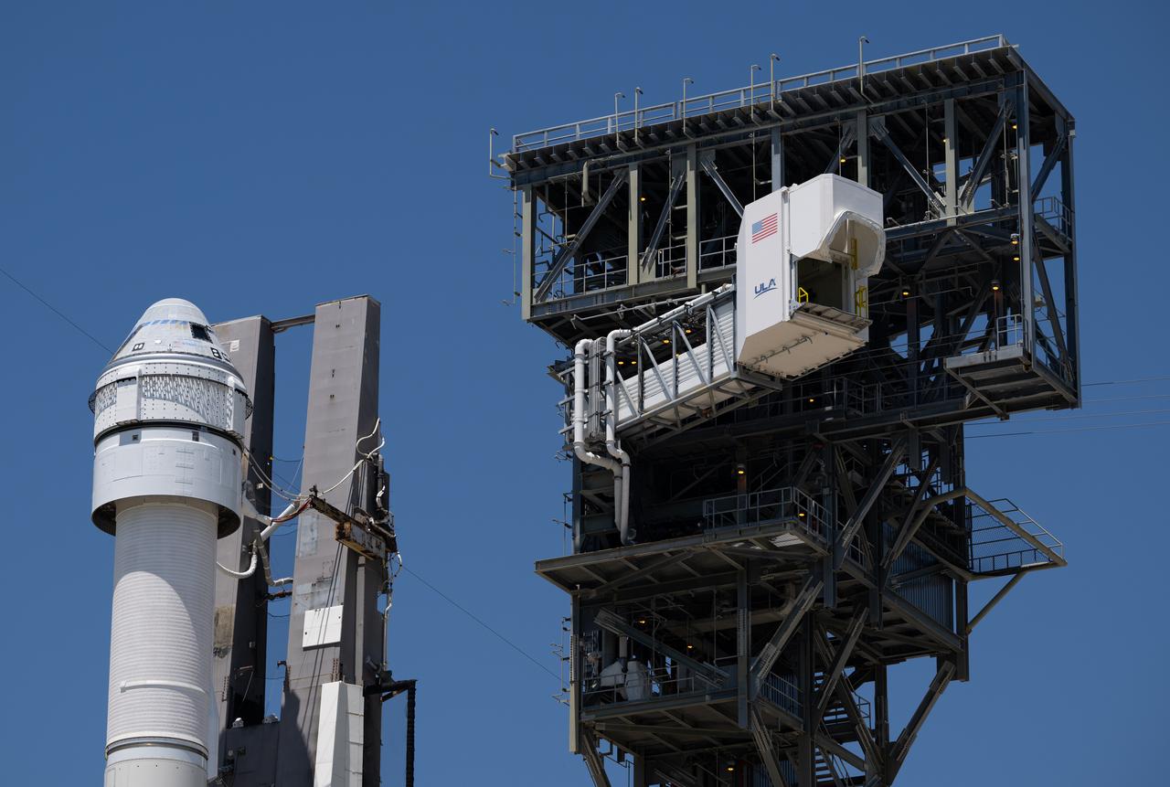 The crew access arm is seen as it is swung into position after a United Launch Alliance Atlas V rocket with Boeing’s CST-100 Starliner spacecraft aboard was rolled out of the Vertical Integration Facility to the launch pad at Space Launch Complex 41 ahead of the NASA’s Boeing Crew Flight Test, Thursday, May 30, 2024 at Cape Canaveral Space Force Station in Florida. NASA’s Boeing Crew Flight Test is the first launch with astronauts of the Boeing CFT-100 spacecraft and United Launch Alliance Atlas V rocket to the International Space Station as part of the agency’s Commercial Crew Program. The flight test, targeted for launch at 12:25 p.m. EDT on Saturday, June 1, serves as an end-to-end demonstration of Boeing’s crew transportation system and will carry NASA astronauts Butch Wilmore and Suni Williams to and from the orbiting laboratory. Photo Credit: (NASA/Joel Kowsky)