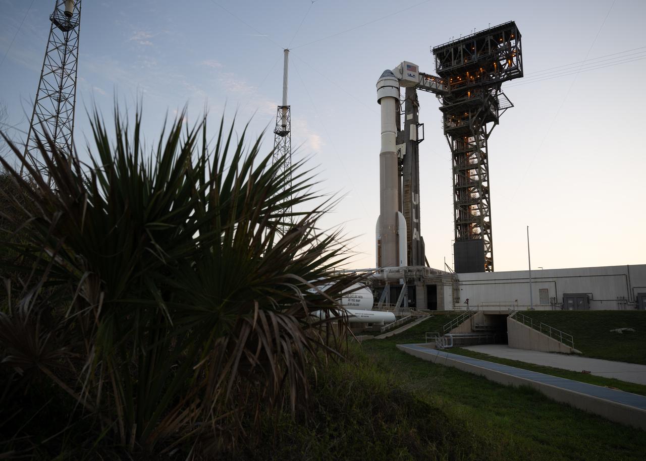 A United Launch Alliance Atlas V rocket with Boeing’s CST-100 Starliner spacecraft aboard is seen at sunset on the launch pad at Space Launch Complex 41 ahead of the NASA’s Boeing Crew Flight Test, Thursday, May 30, 2024 at Cape Canaveral Space Force Station in Florida. NASA’s Boeing Crew Flight Test is the first launch with astronauts of the Boeing CFT-100 spacecraft and United Launch Alliance Atlas V rocket to the International Space Station as part of the agency’s Commercial Crew Program. The flight test, targeted for launch at 12:25 p.m. EDT on Saturday, June 1, serves as an end-to-end demonstration of Boeing’s crew transportation system and will carry NASA astronauts Butch Wilmore and Suni Williams to and from the orbiting laboratory. Photo Credit: (NASA/Joel Kowsky)