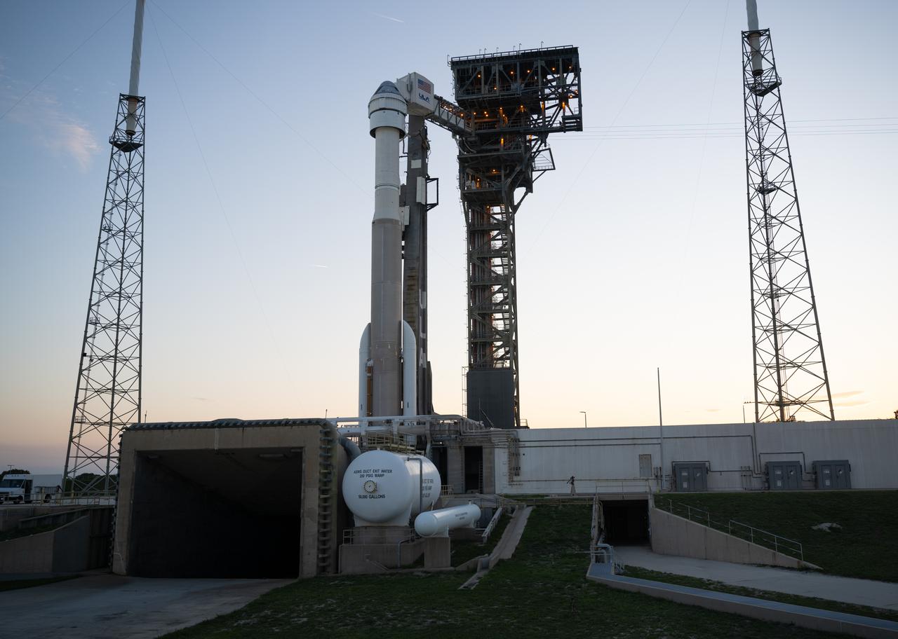 A United Launch Alliance Atlas V rocket with Boeing’s CST-100 Starliner spacecraft aboard is seen at sunset on the launch pad at Space Launch Complex 41 ahead of the NASA’s Boeing Crew Flight Test, Thursday, May 30, 2024 at Cape Canaveral Space Force Station in Florida. NASA’s Boeing Crew Flight Test is the first launch with astronauts of the Boeing CFT-100 spacecraft and United Launch Alliance Atlas V rocket to the International Space Station as part of the agency’s Commercial Crew Program. The flight test, targeted for launch at 12:25 p.m. EDT on Saturday, June 1, serves as an end-to-end demonstration of Boeing’s crew transportation system and will carry NASA astronauts Butch Wilmore and Suni Williams to and from the orbiting laboratory. Photo Credit: (NASA/Joel Kowsky)