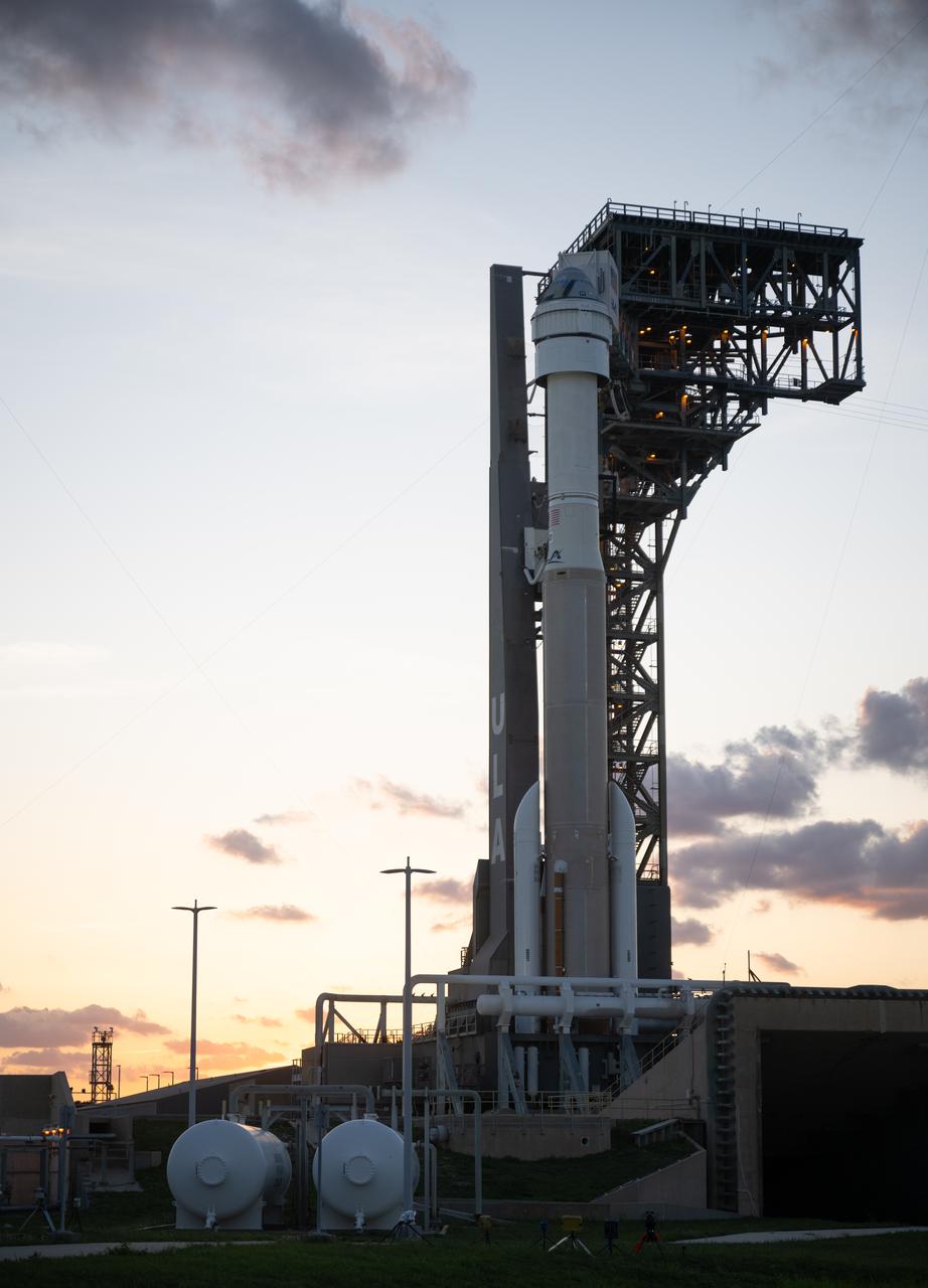 A United Launch Alliance Atlas V rocket with Boeing’s CST-100 Starliner spacecraft aboard is seen at sunset on the launch pad at Space Launch Complex 41 ahead of the NASA’s Boeing Crew Flight Test, Friday, May 31, 2024 at Cape Canaveral Space Force Station in Florida. NASA’s Boeing Crew Flight Test is the first launch with astronauts of the Boeing CFT-100 spacecraft and United Launch Alliance Atlas V rocket to the International Space Station as part of the agency’s Commercial Crew Program. The flight test, targeted for launch at 12:25 p.m. EDT on Saturday, June 1, serves as an end-to-end demonstration of Boeing’s crew transportation system and will carry NASA astronauts Butch Wilmore and Suni Williams to and from the orbiting laboratory. Photo Credit: (NASA/Joel Kowsky)