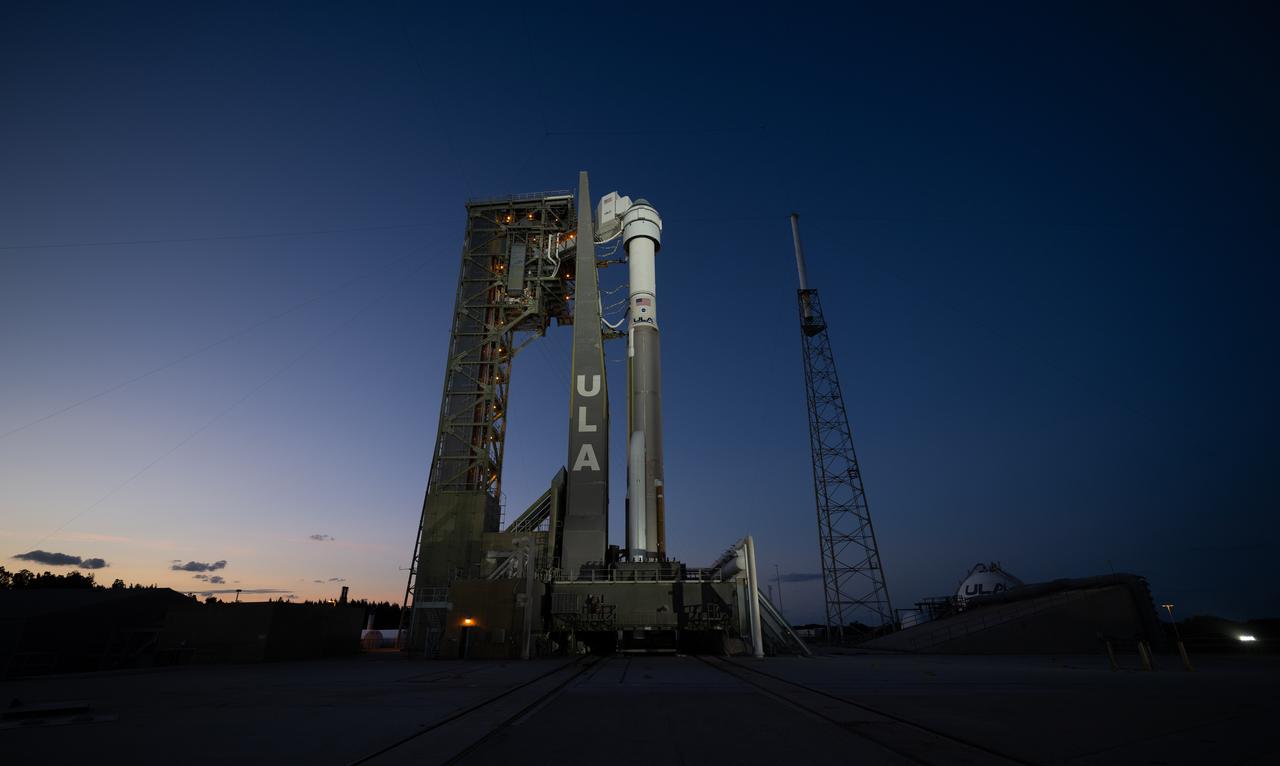 A United Launch Alliance Atlas V rocket with Boeing’s CST-100 Starliner spacecraft aboard is seen at sunset on the launch pad at Space Launch Complex 41 ahead of the NASA’s Boeing Crew Flight Test, Friday, May 31, 2024 at Cape Canaveral Space Force Station in Florida. NASA’s Boeing Crew Flight Test is the first launch with astronauts of the Boeing CFT-100 spacecraft and United Launch Alliance Atlas V rocket to the International Space Station as part of the agency’s Commercial Crew Program. The flight test, targeted for launch at 12:25 p.m. EDT on Saturday, June 1, serves as an end-to-end demonstration of Boeing’s crew transportation system and will carry NASA astronauts Butch Wilmore and Suni Williams to and from the orbiting laboratory. Photo Credit: (NASA/Joel Kowsky)