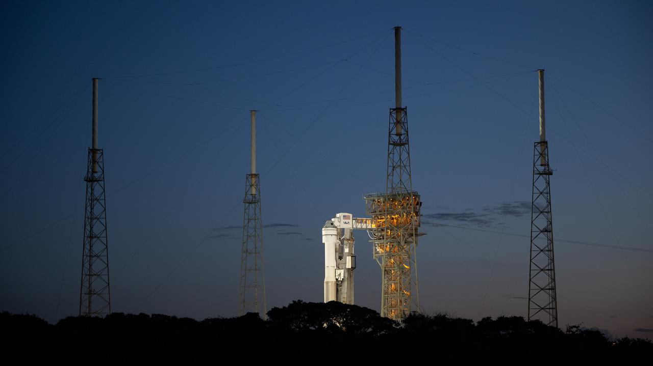A United Launch Alliance Atlas V rocket with Boeing’s CST-100 Starliner spacecraft aboard is seen at sunset on the launch pad at Space Launch Complex 41 ahead of the NASA’s Boeing Crew Flight Test, Friday, May 31, 2024 at Cape Canaveral Space Force Station in Florida. NASA’s Boeing Crew Flight Test is the first launch with astronauts of the Boeing CFT-100 spacecraft and United Launch Alliance Atlas V rocket to the International Space Station as part of the agency’s Commercial Crew Program. The flight test, targeted for launch at 12:25 p.m. EDT on Saturday, June 1, serves as an end-to-end demonstration of Boeing’s crew transportation system and will carry NASA astronauts Butch Wilmore and Suni Williams to and from the orbiting laboratory. Photo Credit: (NASA/Joel Kowsky)