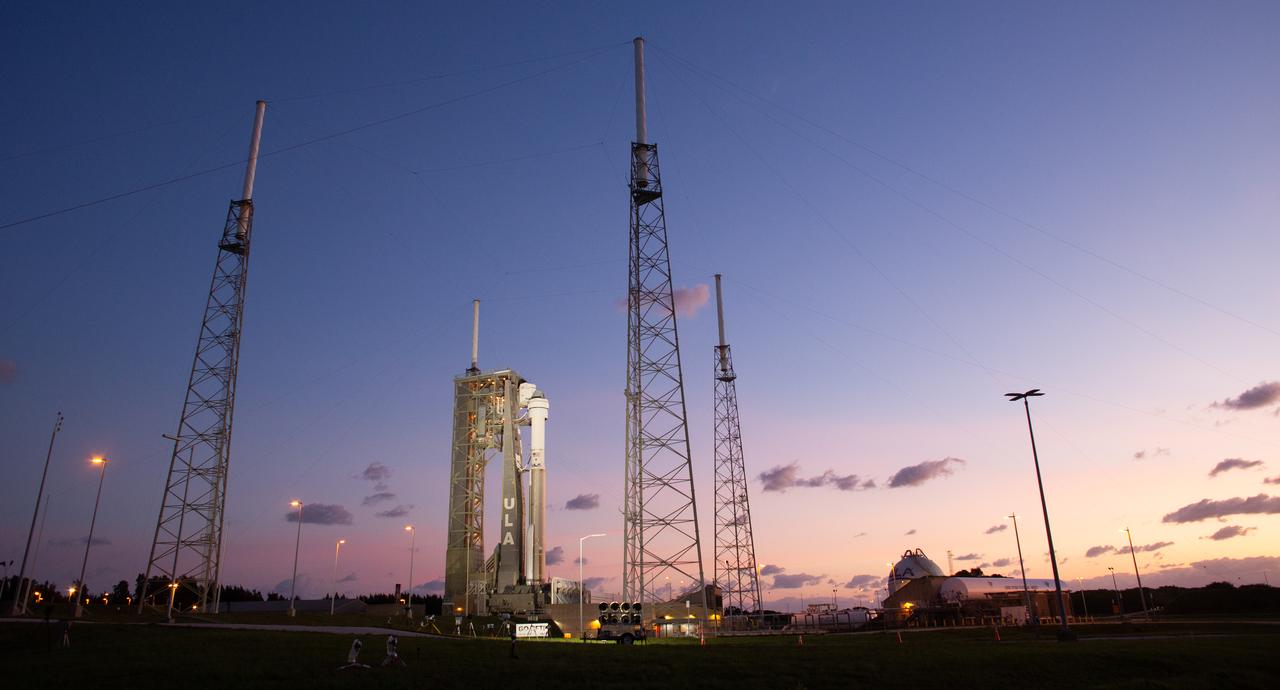 A United Launch Alliance Atlas V rocket with Boeing’s CST-100 Starliner spacecraft aboard is seen at sunrise at Space Launch Complex 41 before the launch attempt was scrubbed, Saturday, June 1, 2024, at Cape Canaveral Space Force Station in Florida. NASA’s Boeing Crew Flight Test is the first launch with astronauts of the Boeing CFT-100 spacecraft and United Launch Alliance Atlas V rocket to the International Space Station as part of the agency’s Commercial Crew Program. The flight test serves as an end-to-end demonstration of Boeing’s crew transportation system and will carry NASA astronauts Butch Wilmore and Suni Williams to and from the orbiting laboratory. Photo Credit: (NASA/Joel Kowsky)