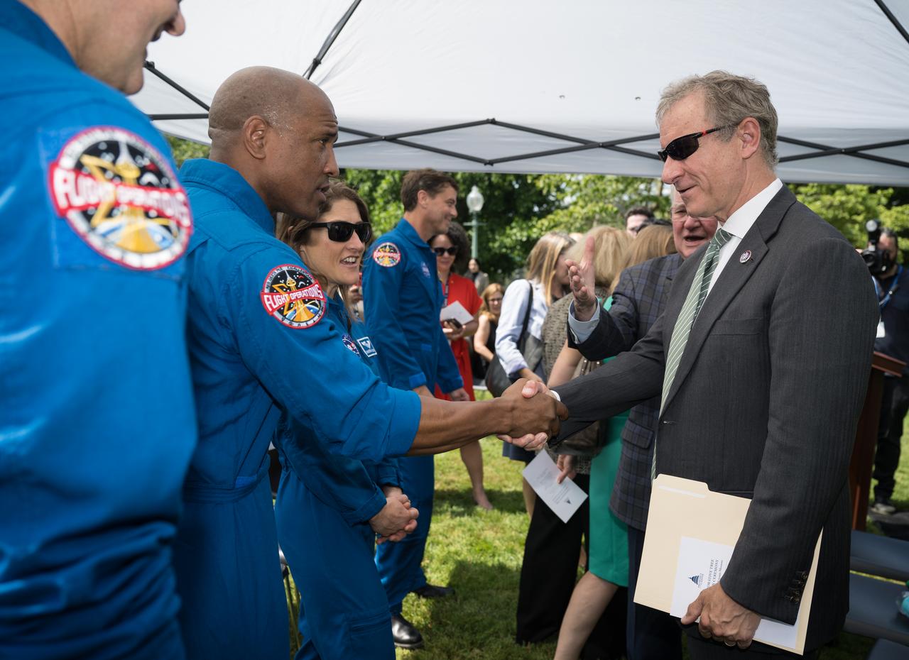 Artemis II astronaut Victor Glover greets U.S. Rep. Matt Cartwright (D-PA) at a Moon tree dedication ceremony, Tuesday, June 4, 2024 at the United States Capitol in Washington. The American Sweetgum tree planted on the southwestern side of the Capitol, was grown from a seed that was flown around the Moon during the Artemis I mission. Photo Credit: (NASA/Aubrey Gemignani)