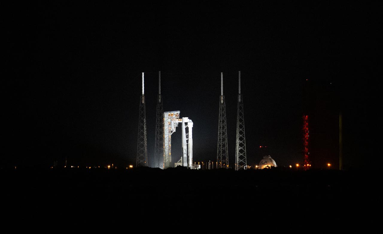A United Launch Alliance Atlas V rocket with Boeing’s CST-100 Starliner spacecraft aboard is seen illuminated by spotlights on the launch pad at Space Launch Complex 41 ahead of the NASA’s Boeing Crew Flight Test, Wednesday, June 5, 2024 at Cape Canaveral Space Force Station in Florida. NASA’s Boeing Crew Flight Test is the first launch with astronauts of the Boeing CFT-100 spacecraft and United Launch Alliance Atlas V rocket to the International Space Station as part of the agency’s Commercial Crew Program. The flight test, targeted for launch at 10:52 a.m. EDT, serves as an end-to-end demonstration of Boeing’s crew transportation system and will carry NASA astronauts Butch Wilmore and Suni Williams to and from the orbiting laboratory. Photo Credit: (NASA/Joel Kowsky)