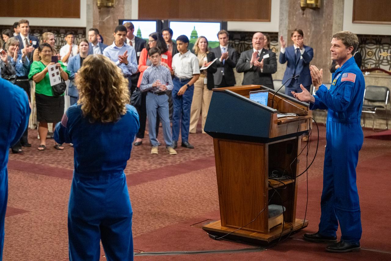 NASA astronaut Reid Wiseman leads a round of applause to recognize the successful launch of United Launch Alliance Atlas V rocket with Boeing’s CST-100 Starliner spacecraft aboard earlier that day, during a reception with Artemis II crew members Wednesday, June 5, 2024, at the Dirksen Senate Office Building in Washington. Photo Credit: (NASA/Keegan Barber)